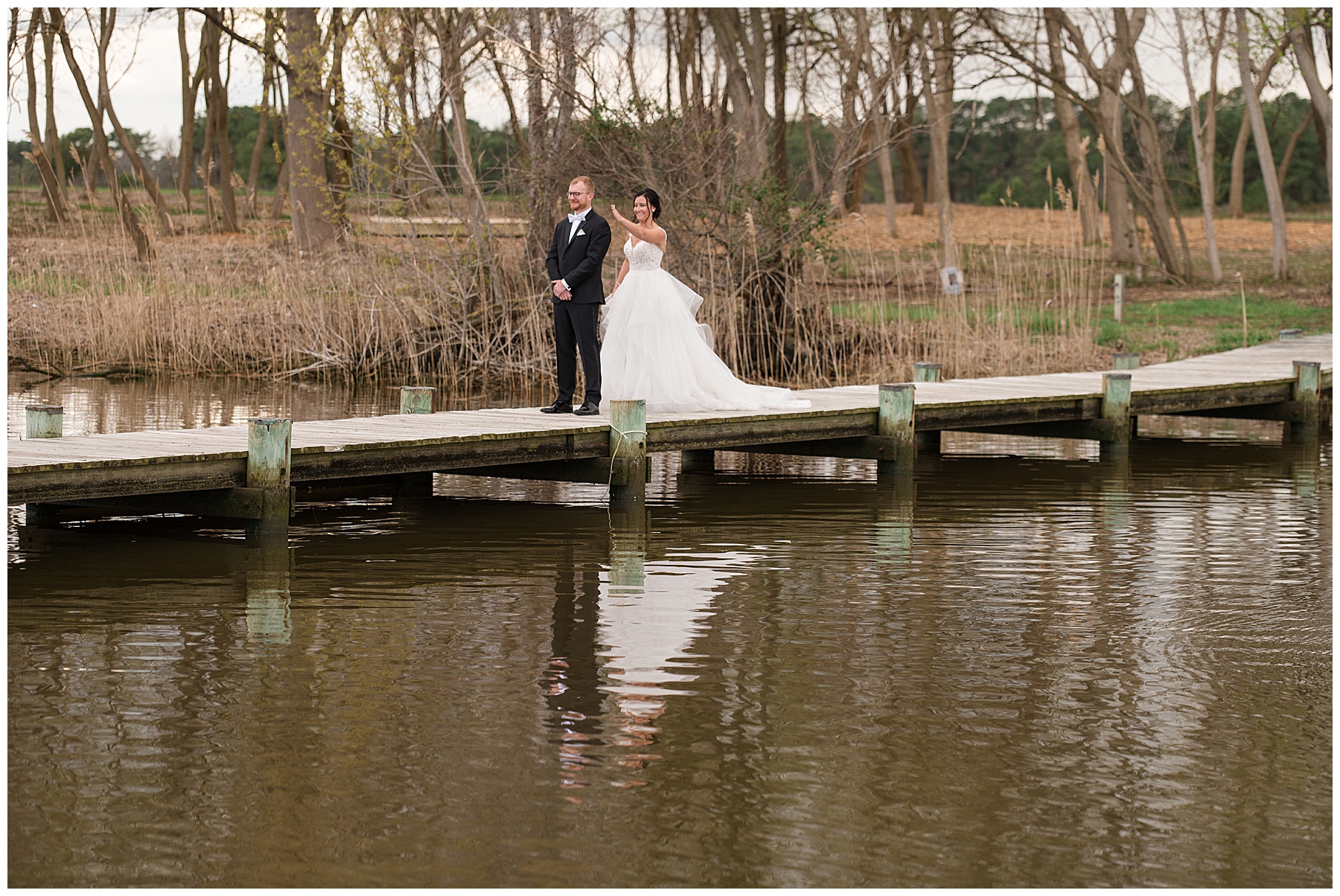 bride and groom first look on pier