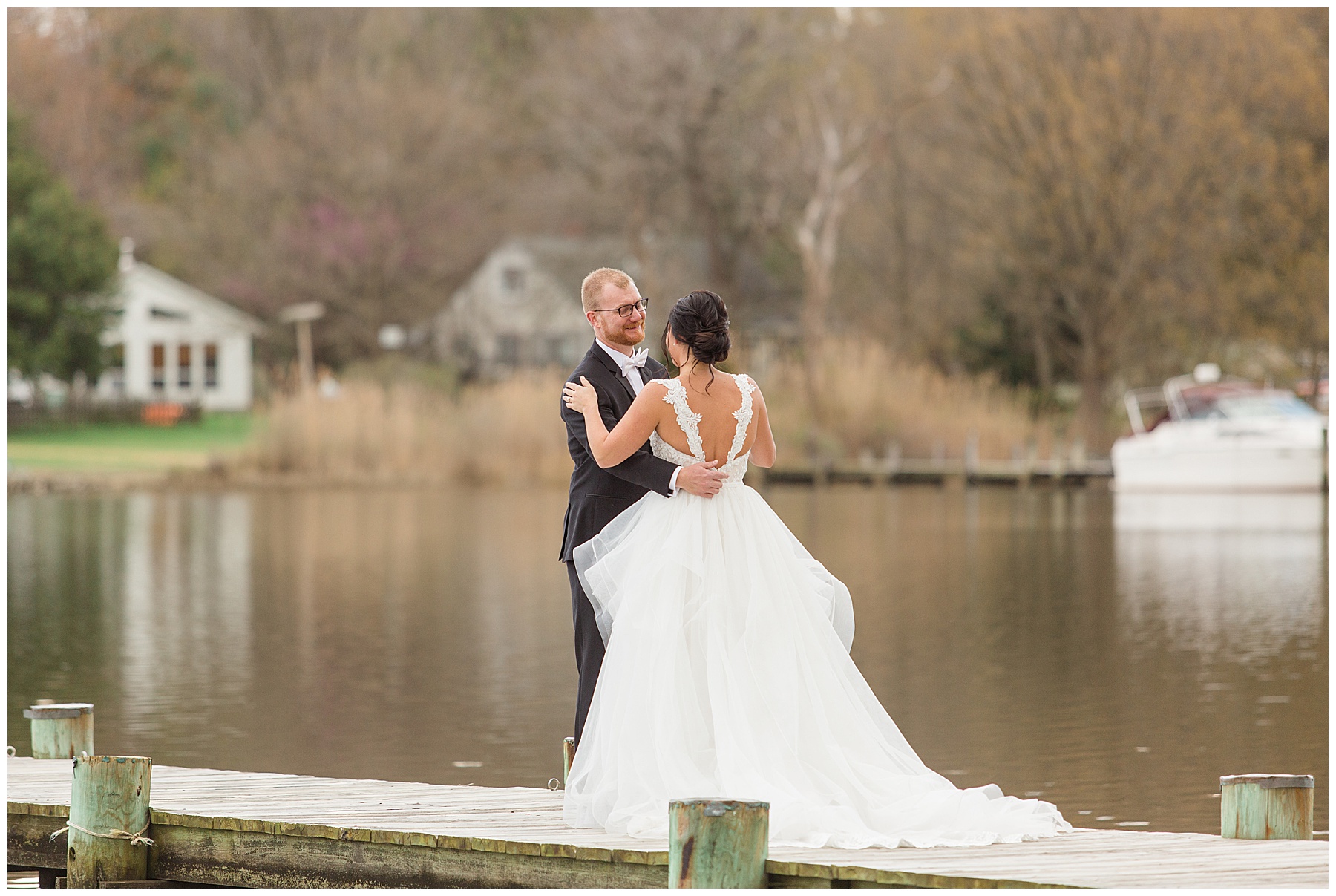 bride and groom first look on pier