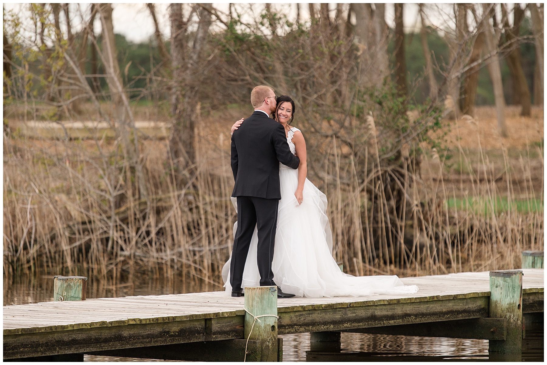 bride and groom first look on pier