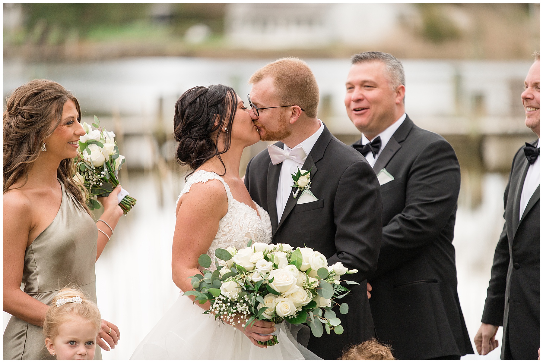 bride and groom share a kiss