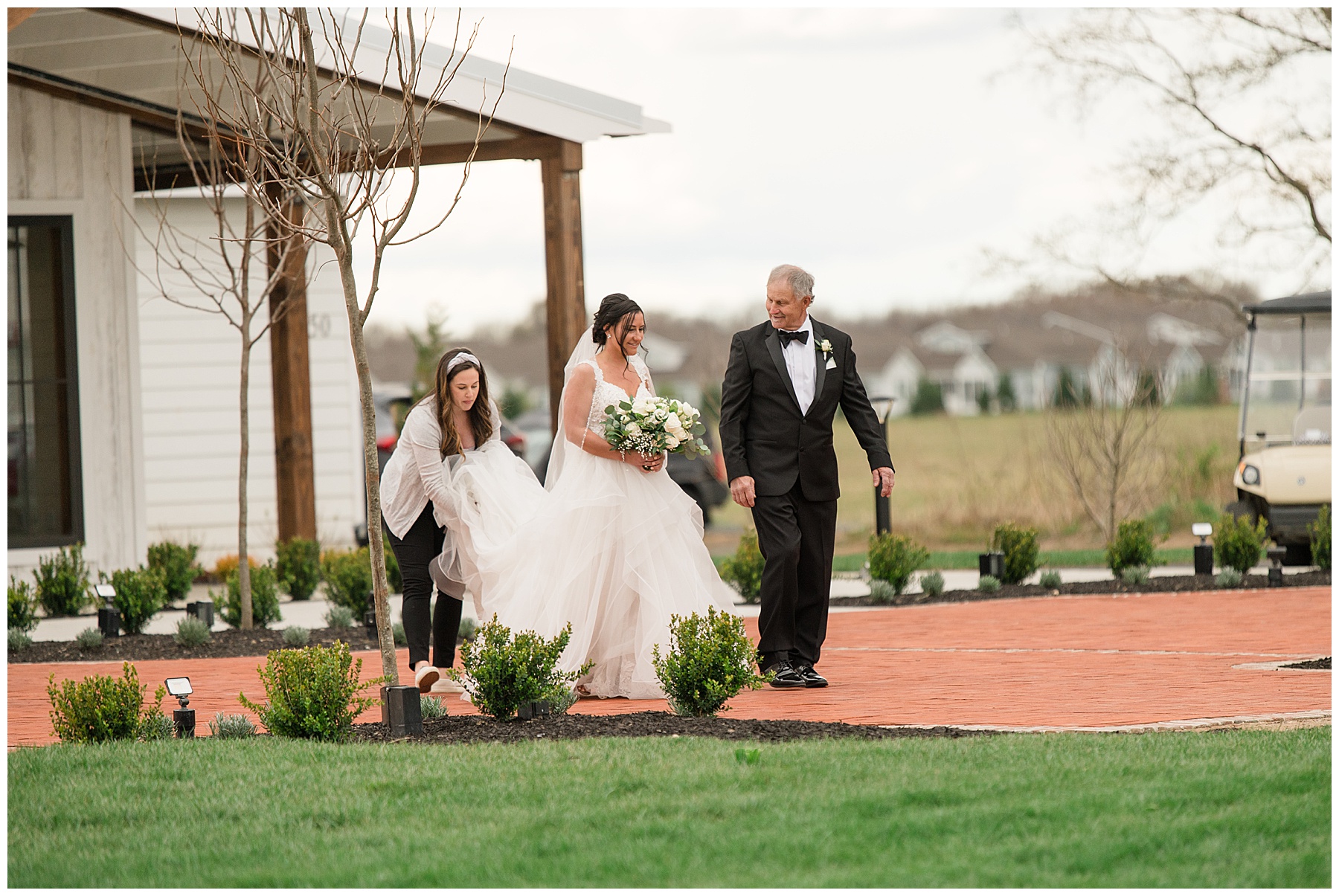 bride entering ceremony with father