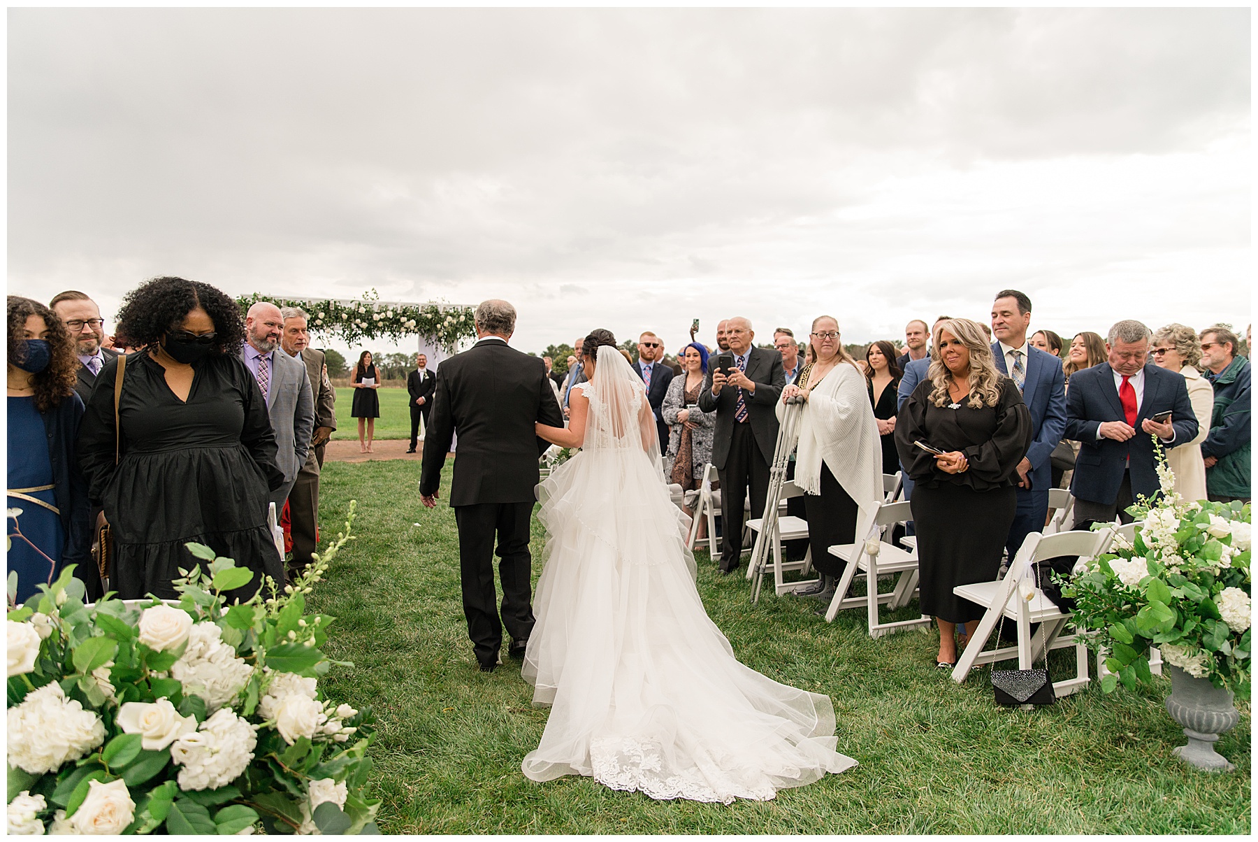 bride entering ceremony with father