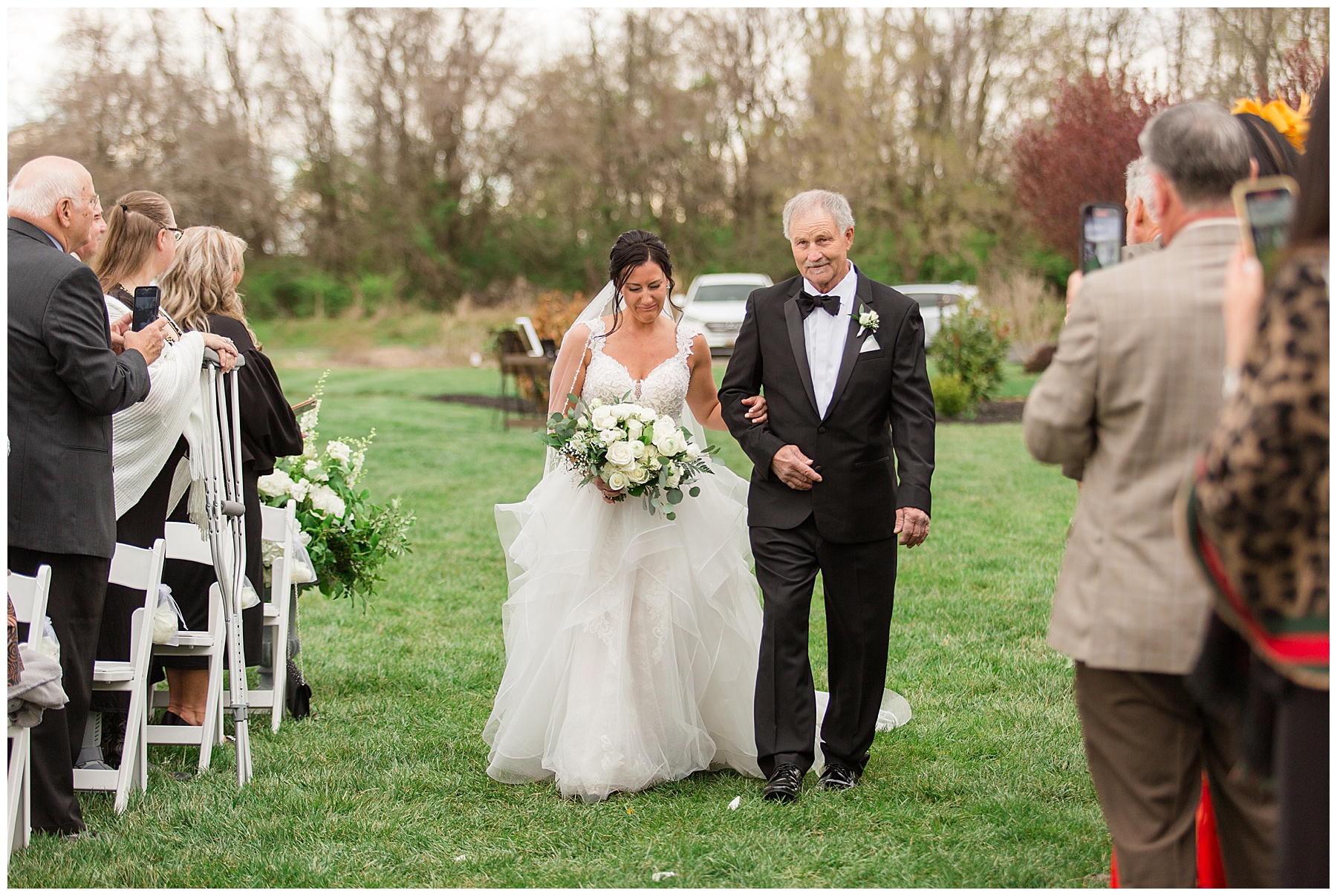 bride entering ceremony with father