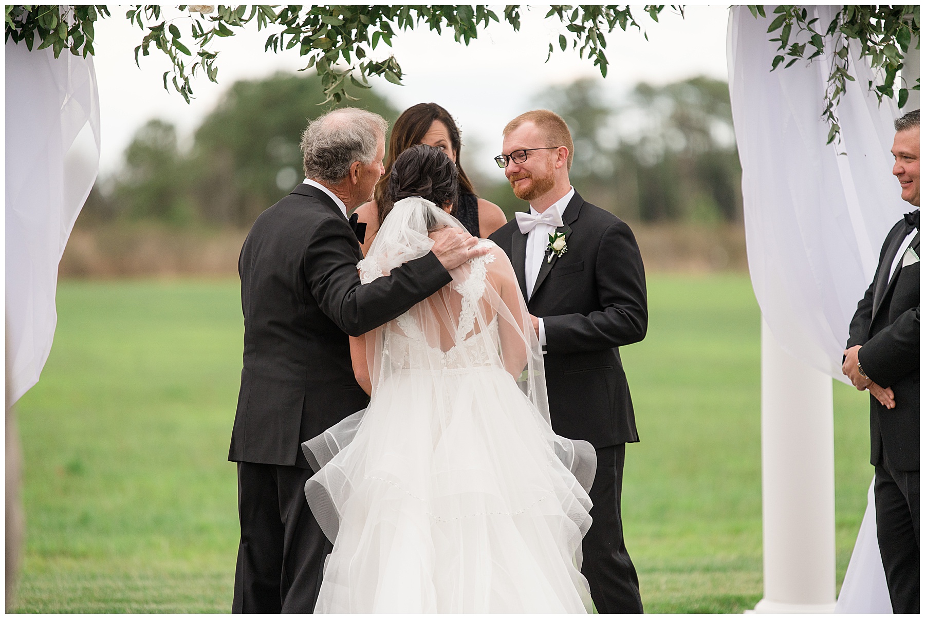 bride entering ceremony with father