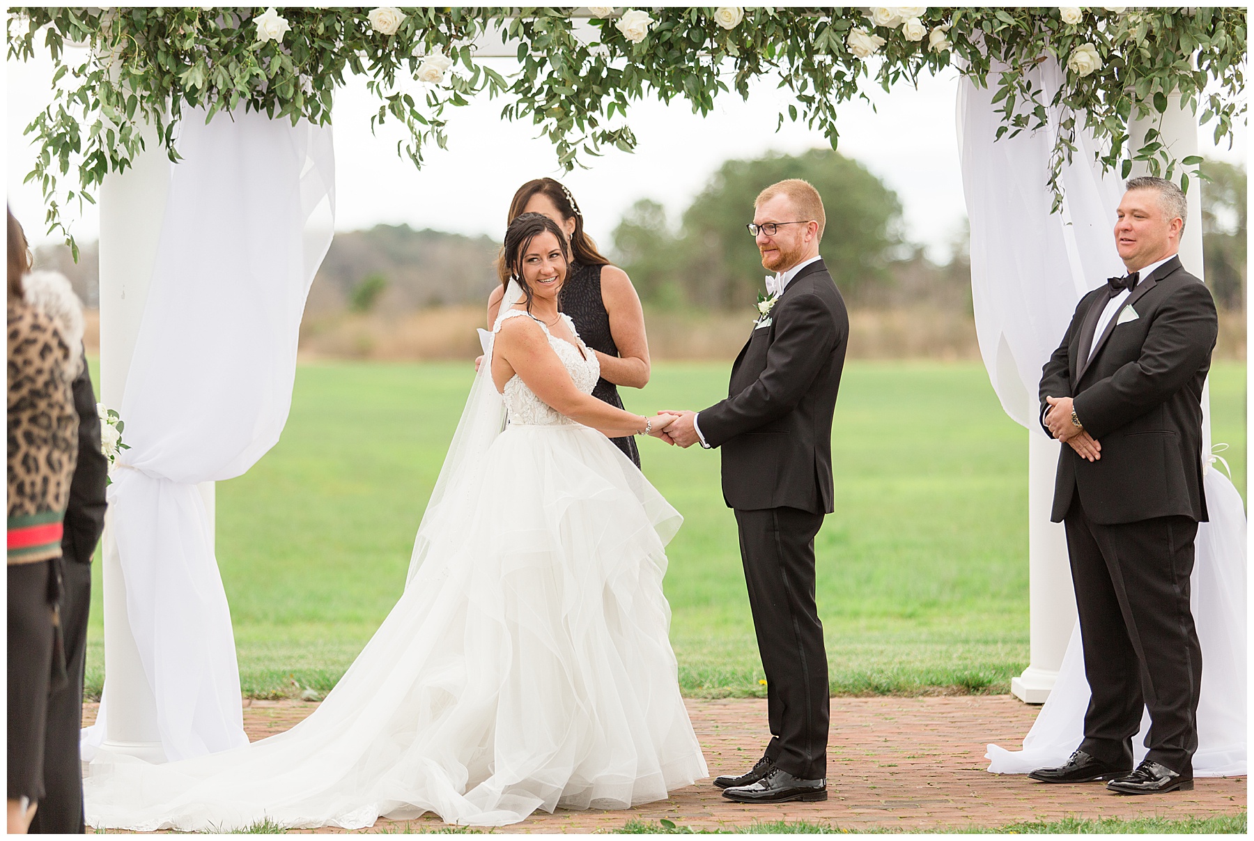 wedding ceremony couple looks at guests