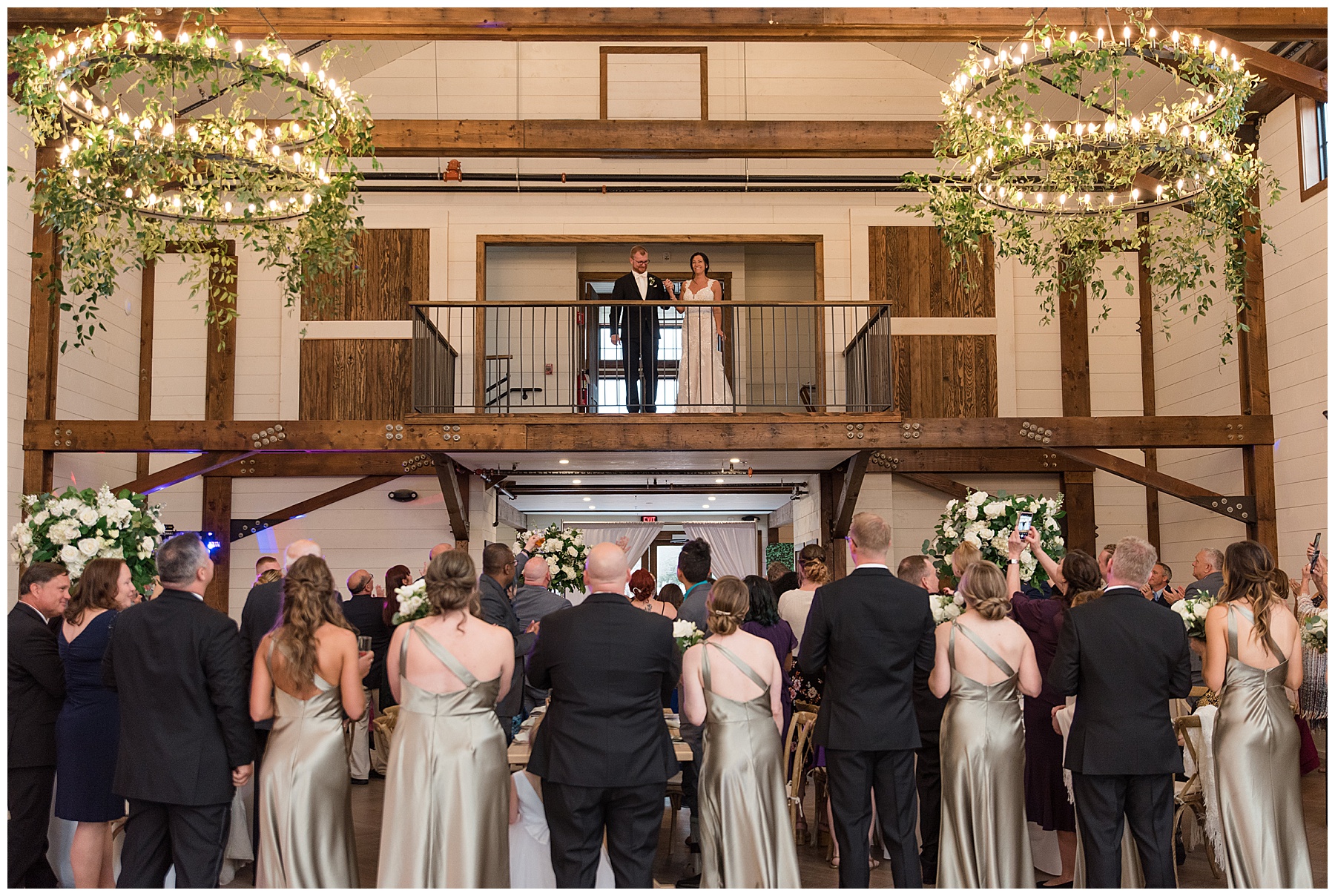 bride and groom enter balcony reception