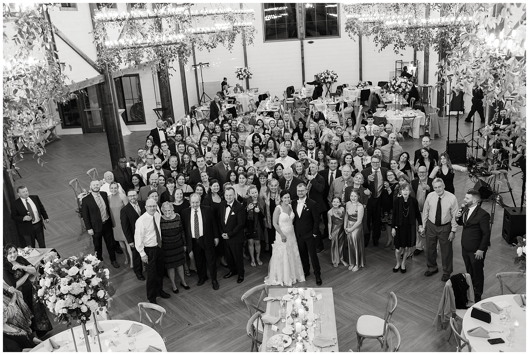 group shot of all wedding guests from balcony