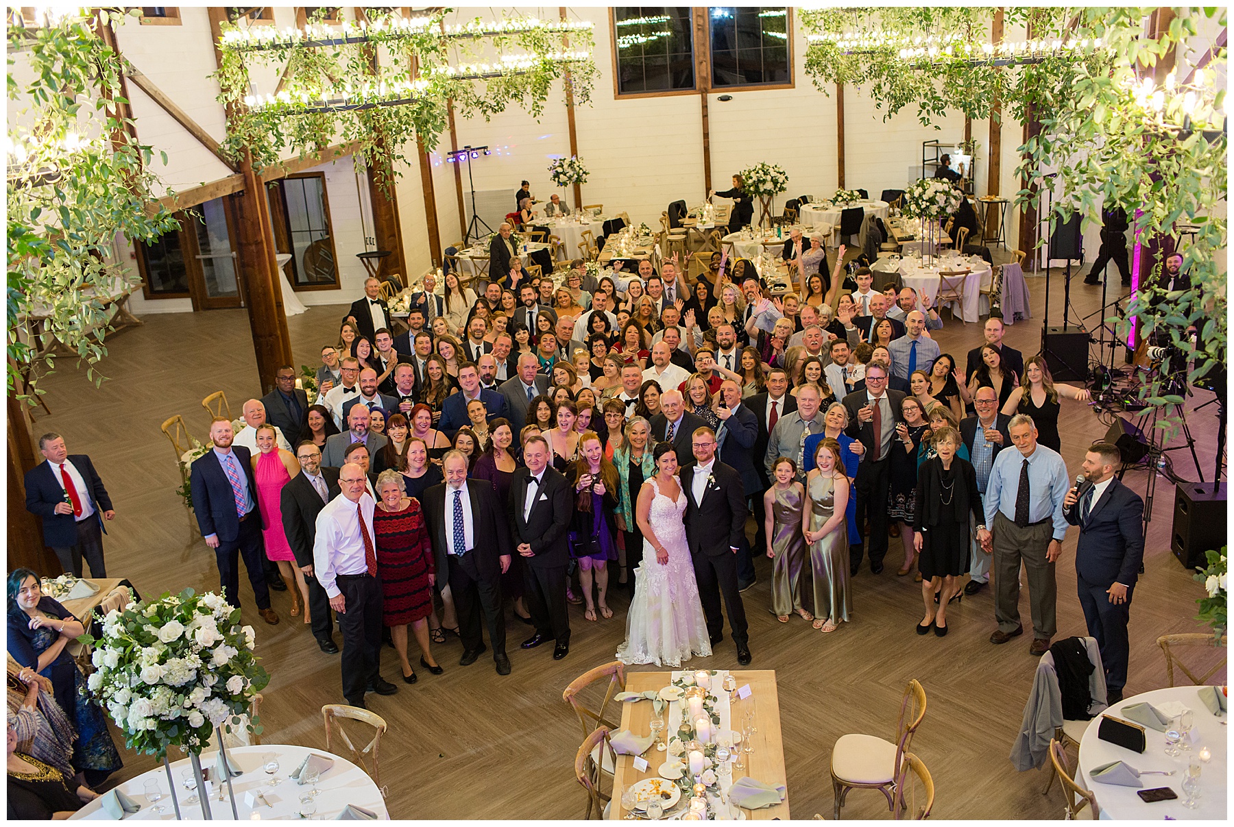 group shot of all wedding guests from balcony