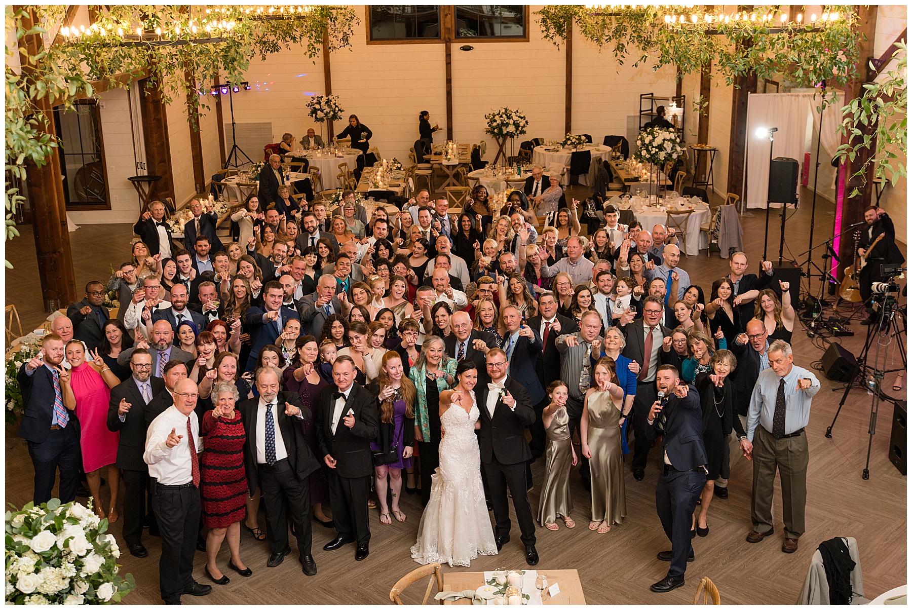 group shot of all wedding guests from balcony