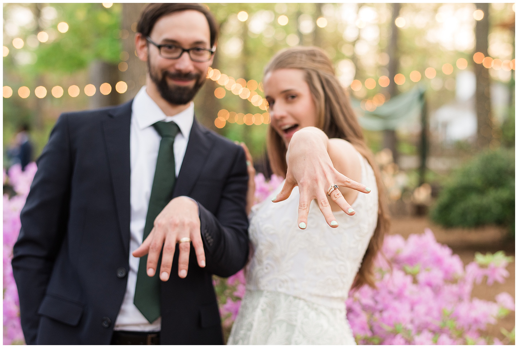 bride and groom portrait show off rings