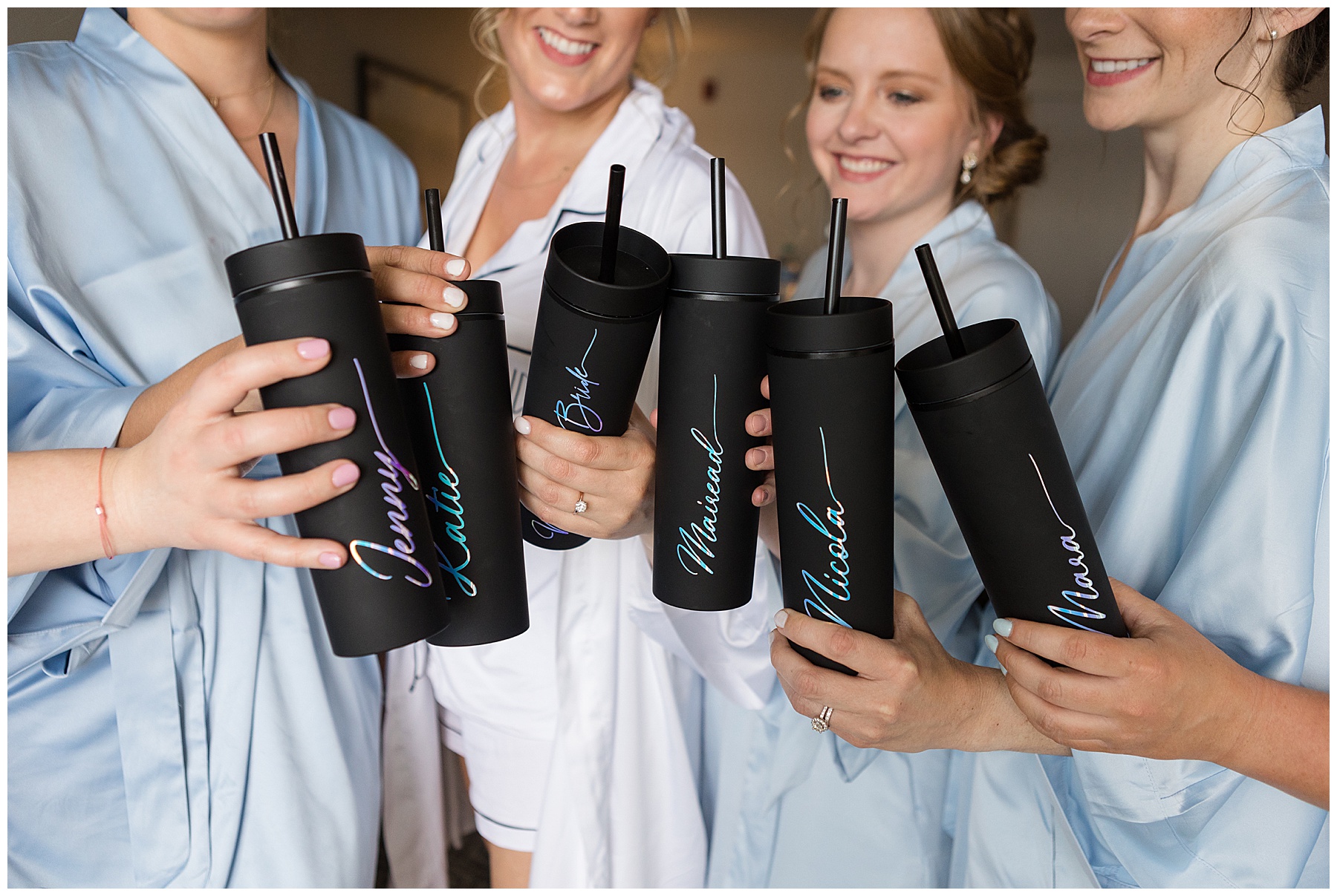 bride and bridemaids getting toast with custom tumblers