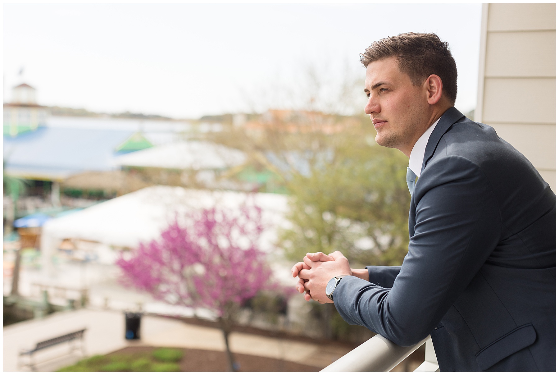 groom looking out on balcony