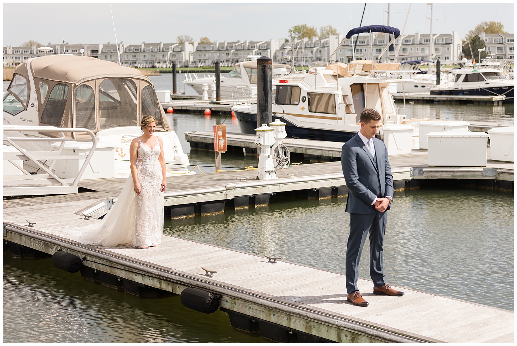 groom waiting on pier for bride first look