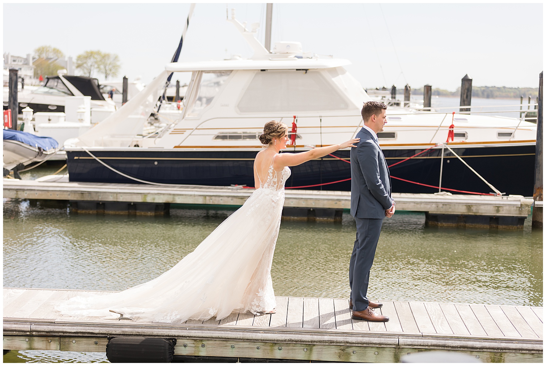 bride and groom first look on pier