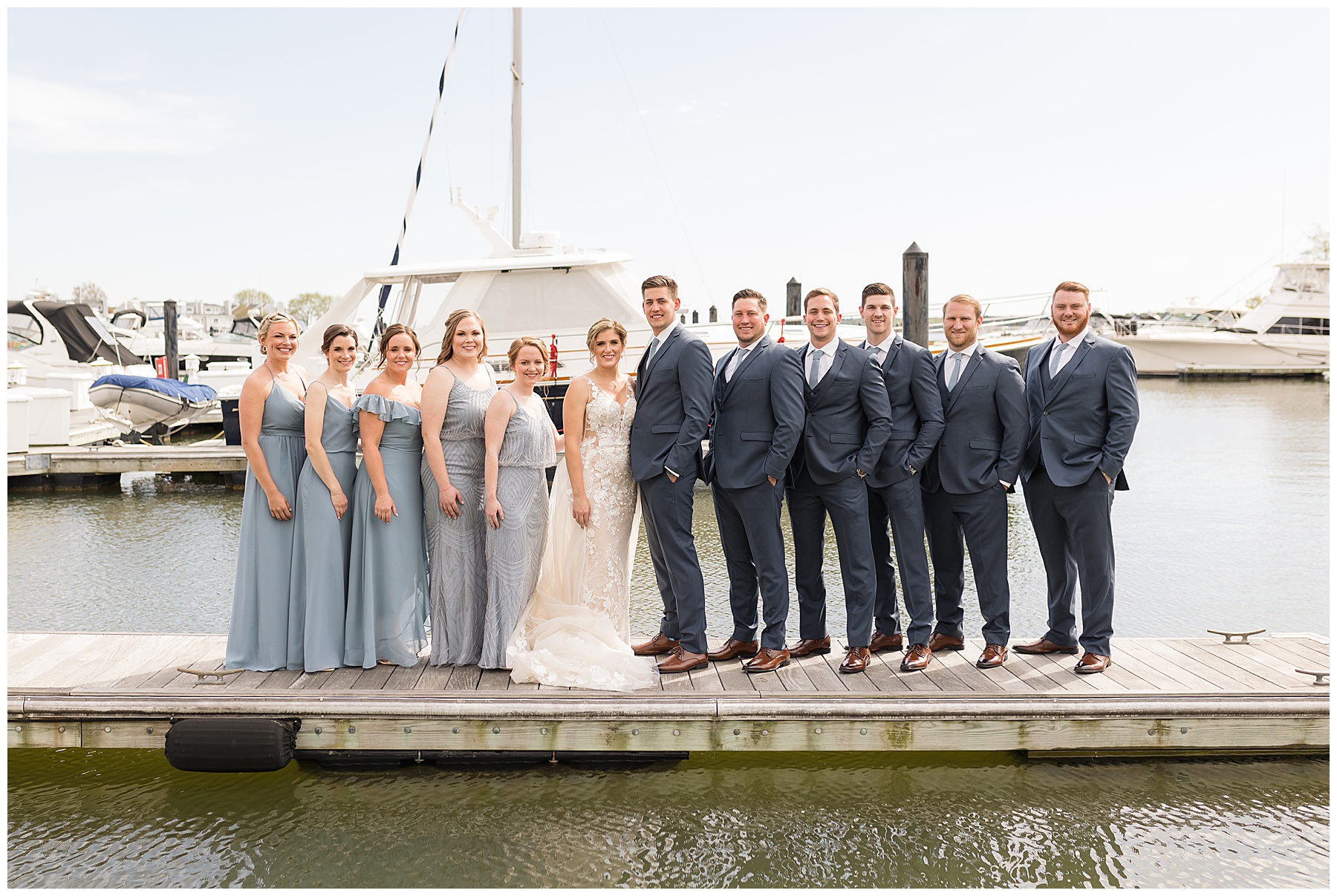 wedding party portrait on pier