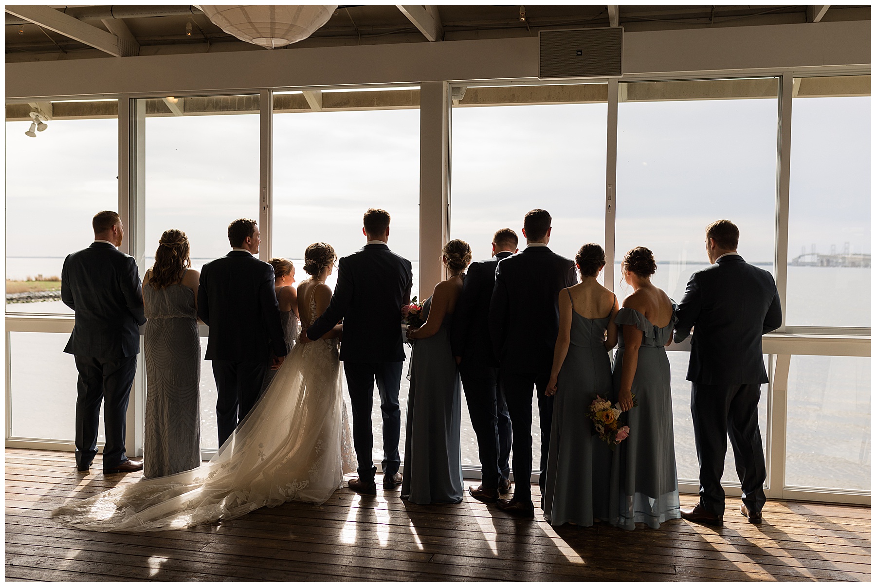 wedding party silhouette looking at bay