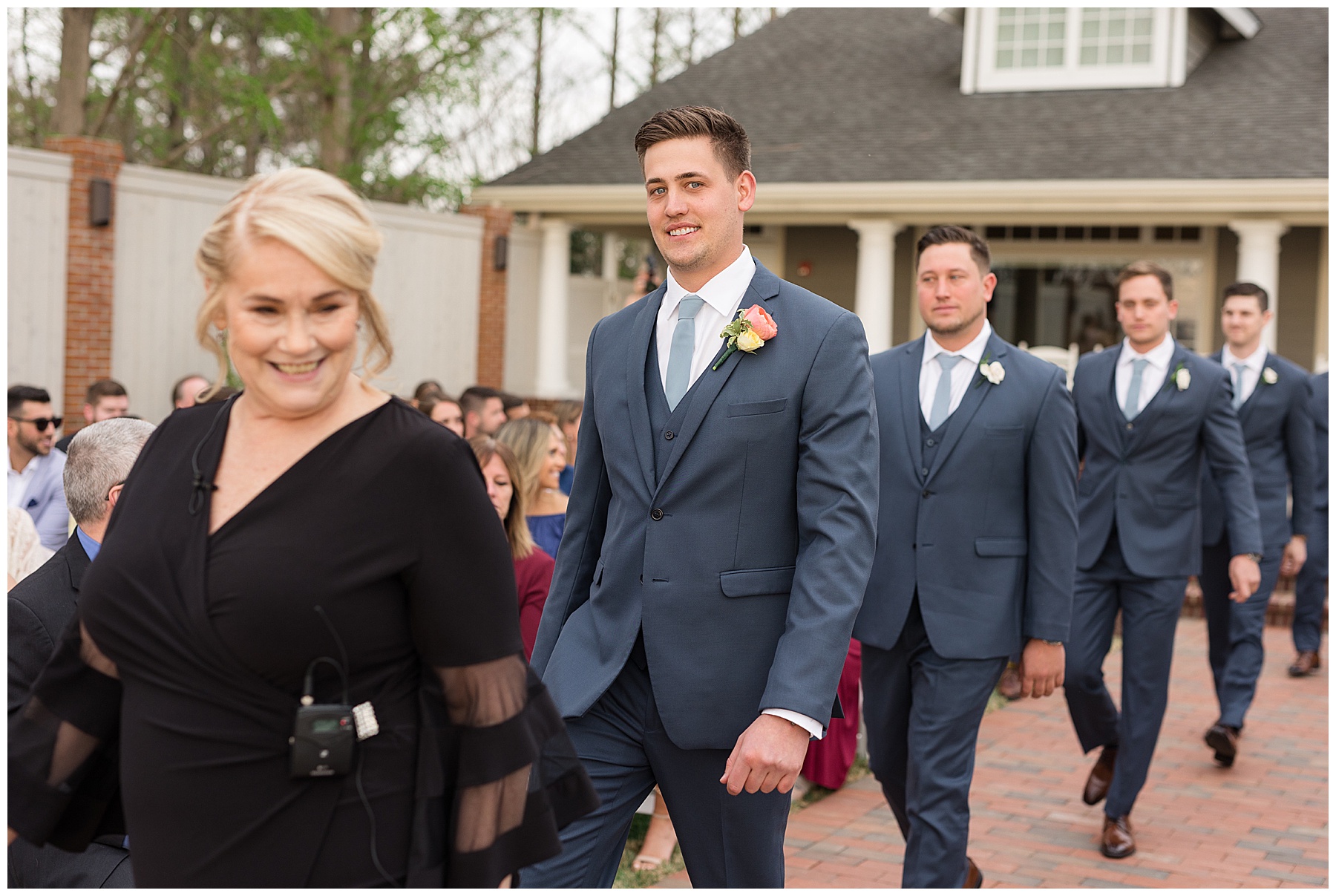 groom entering ceremony beach house