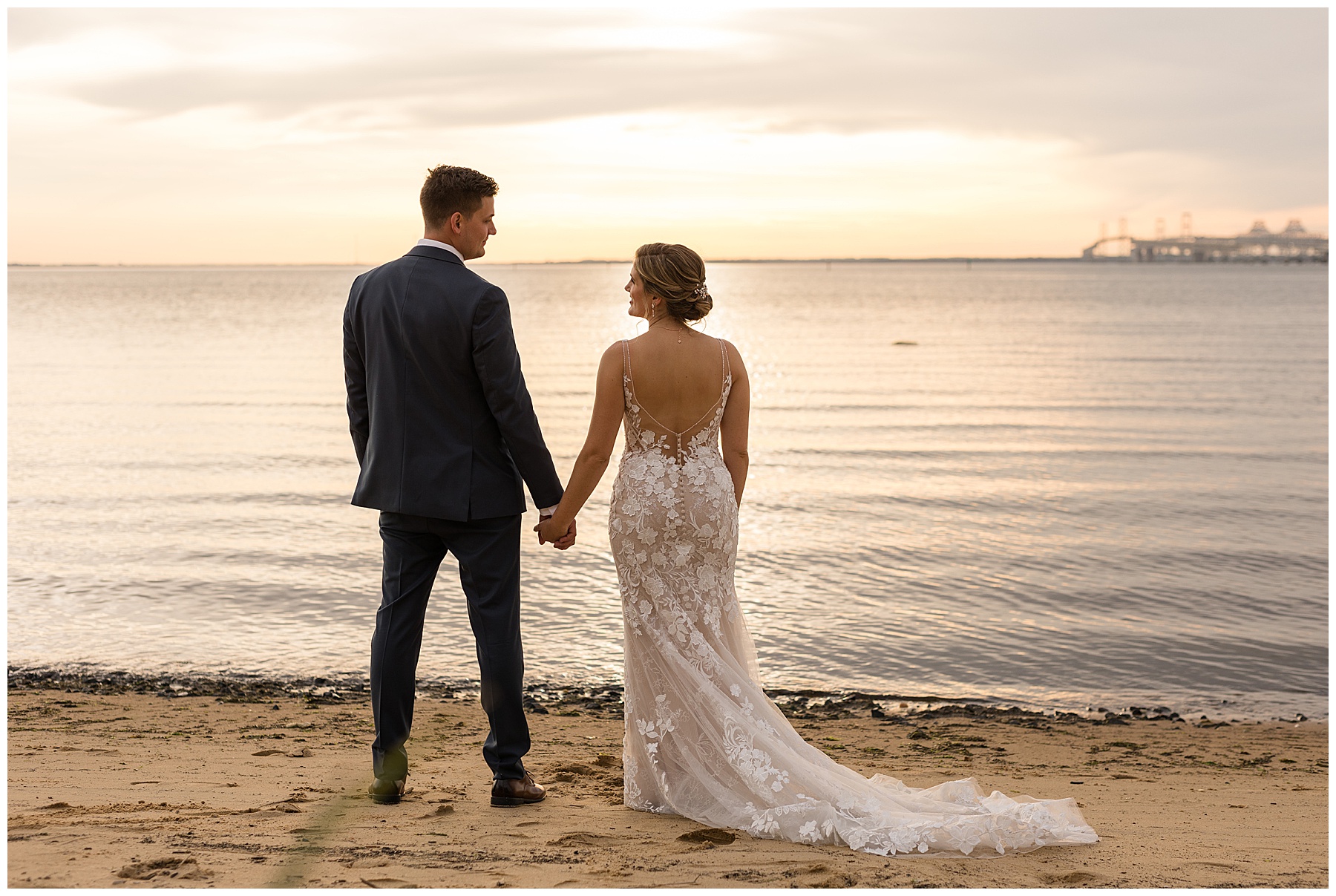 bride and groom on beach at sunset