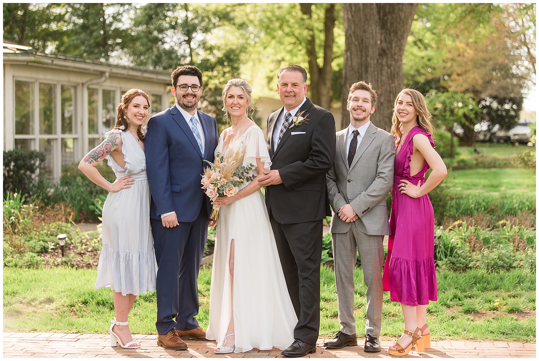 bride and groom with kids family