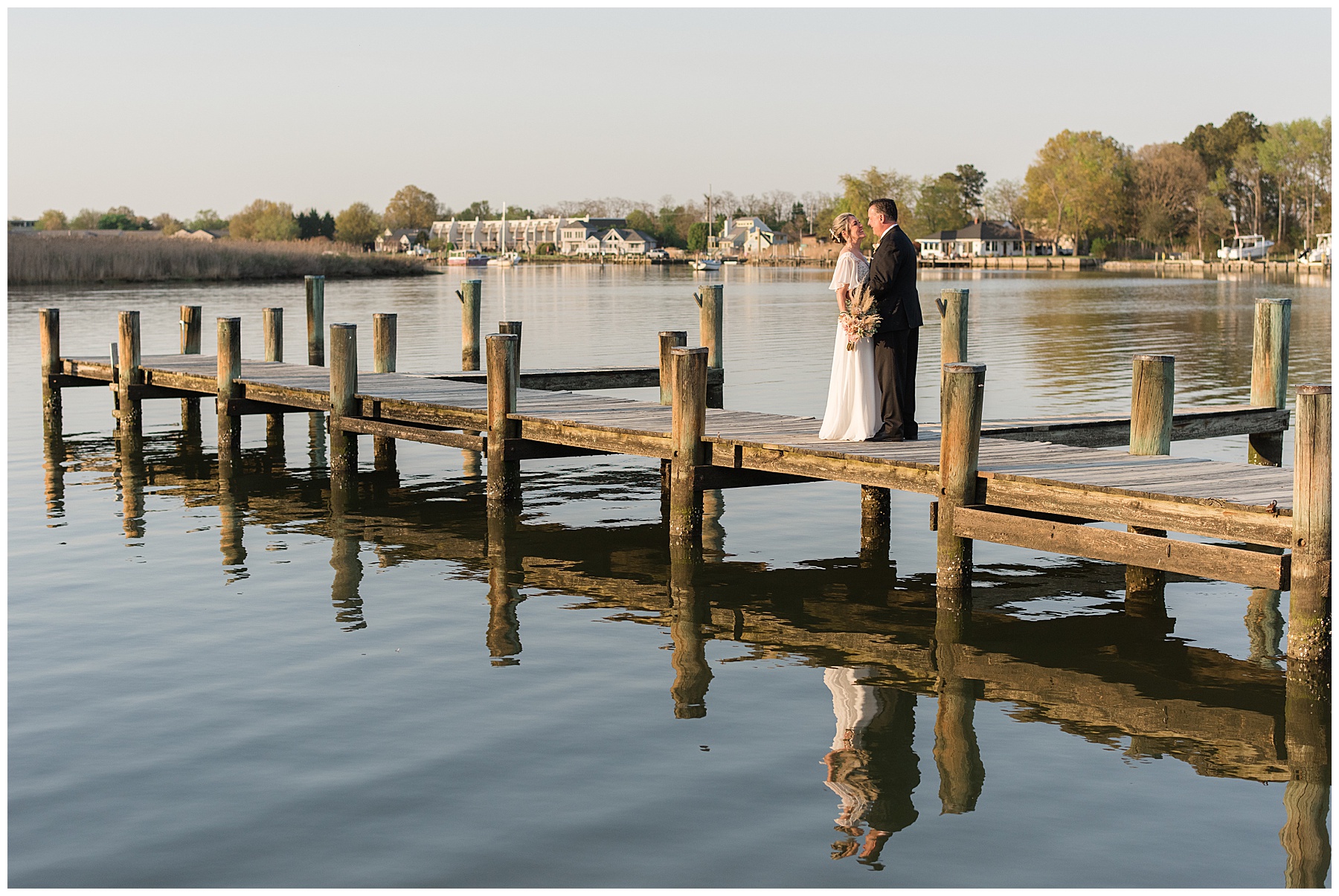 bride and groom portraits golden hour pier