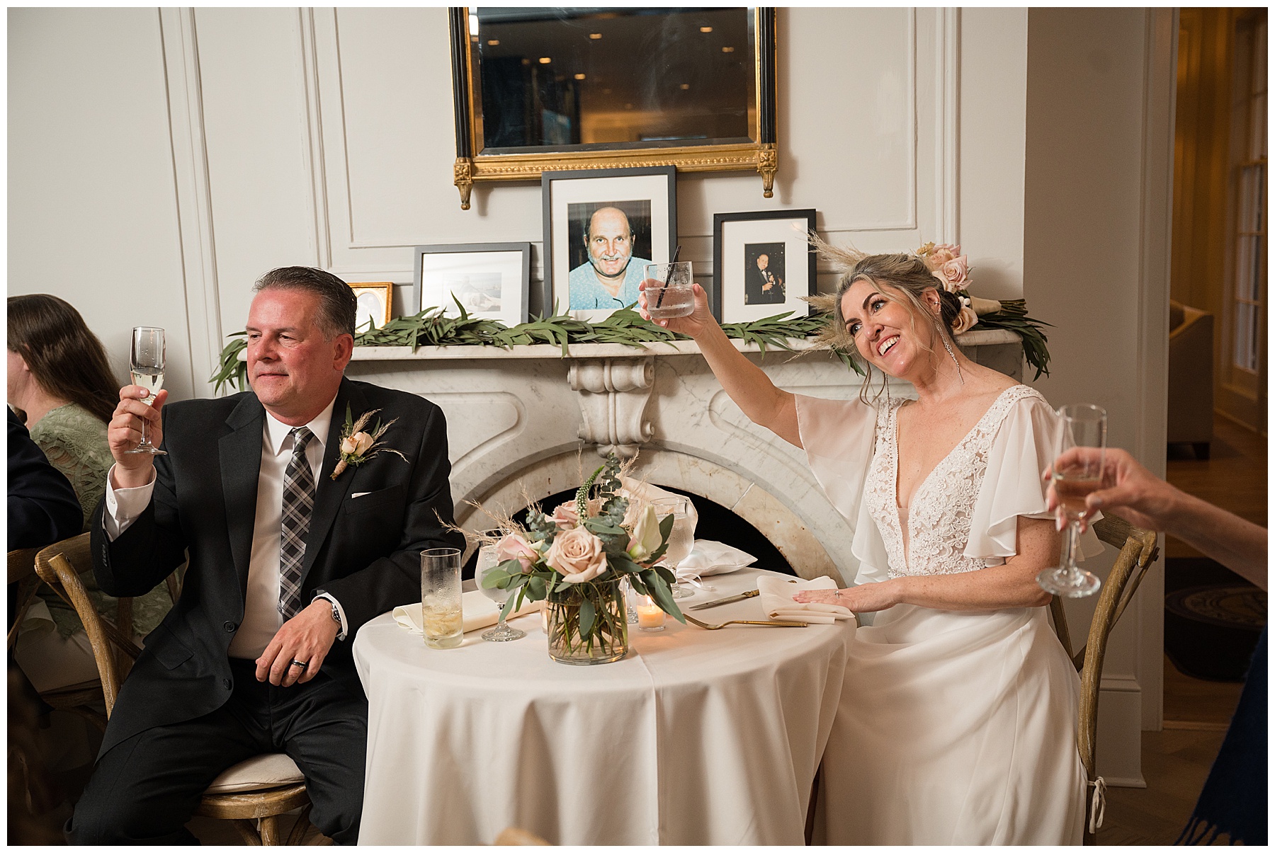 wedding toasts candid bride and groom raise a glass