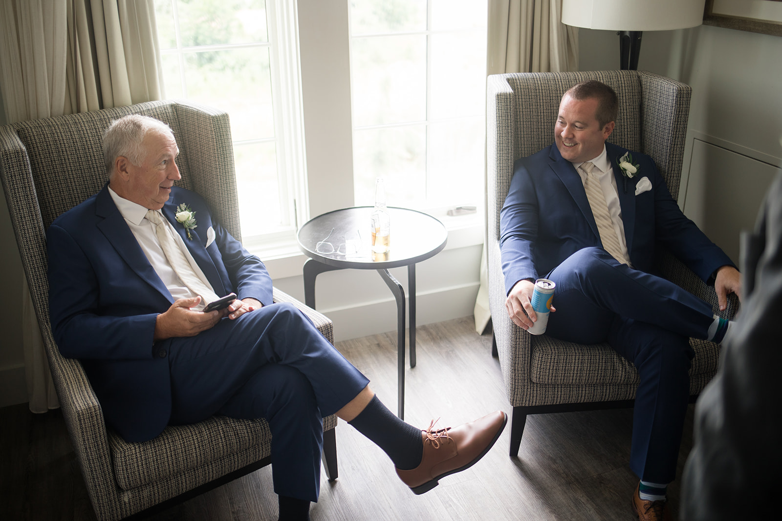 groom getting ready with his dad