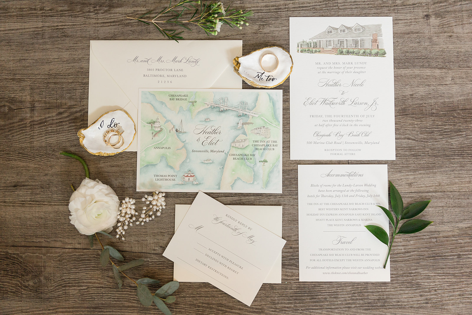 wedding flat lay with invitations and accessories