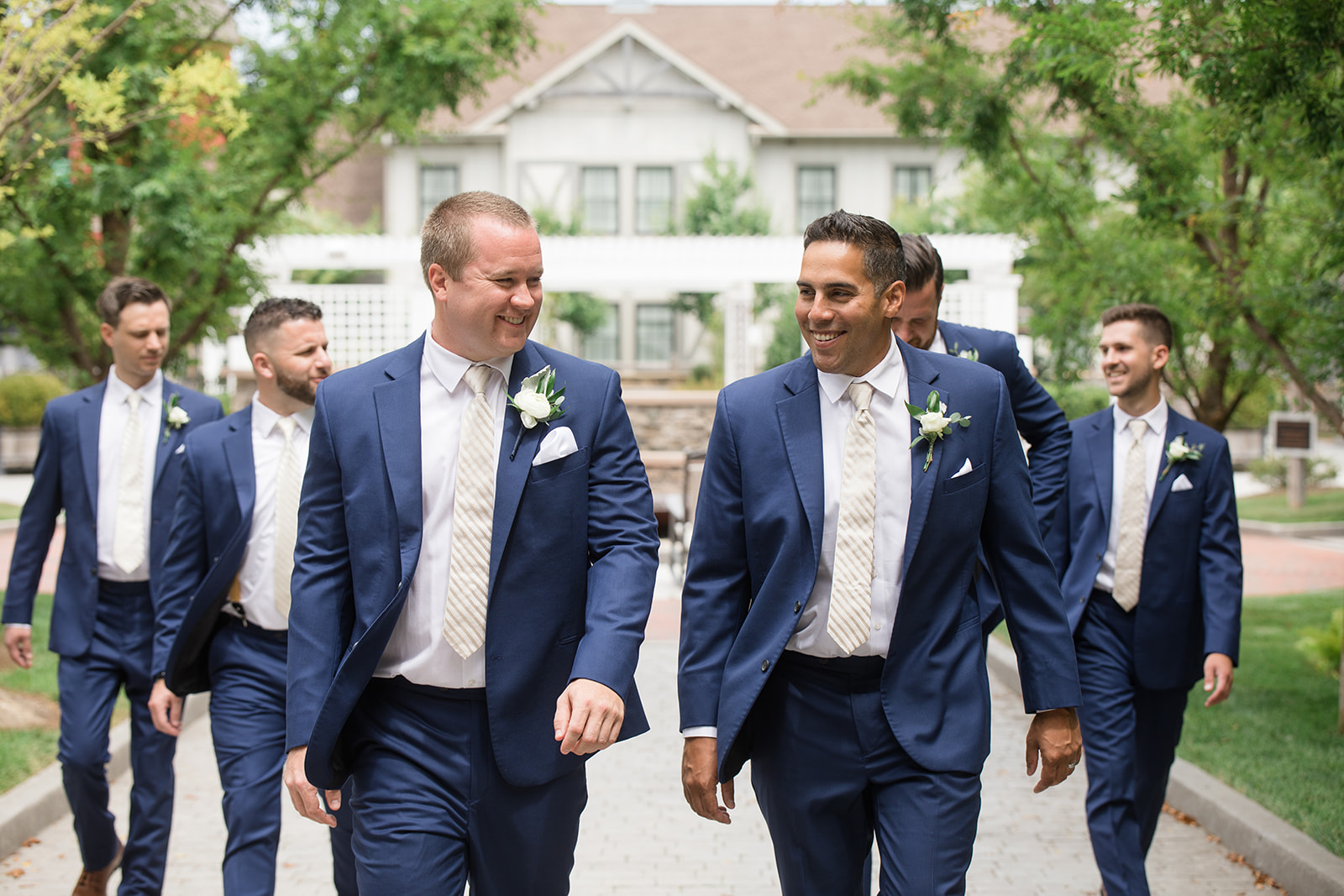 groom and groomsmen walking at chesapeake bay beach club inn