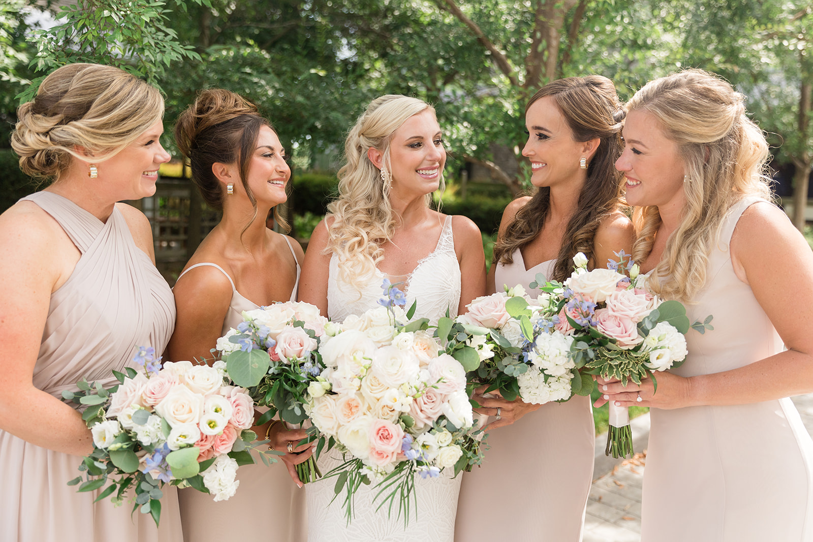 bride smiling at bridesmaids