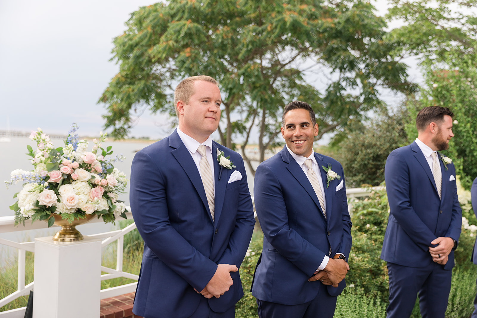 groom waiting for bride at the end of the aisle