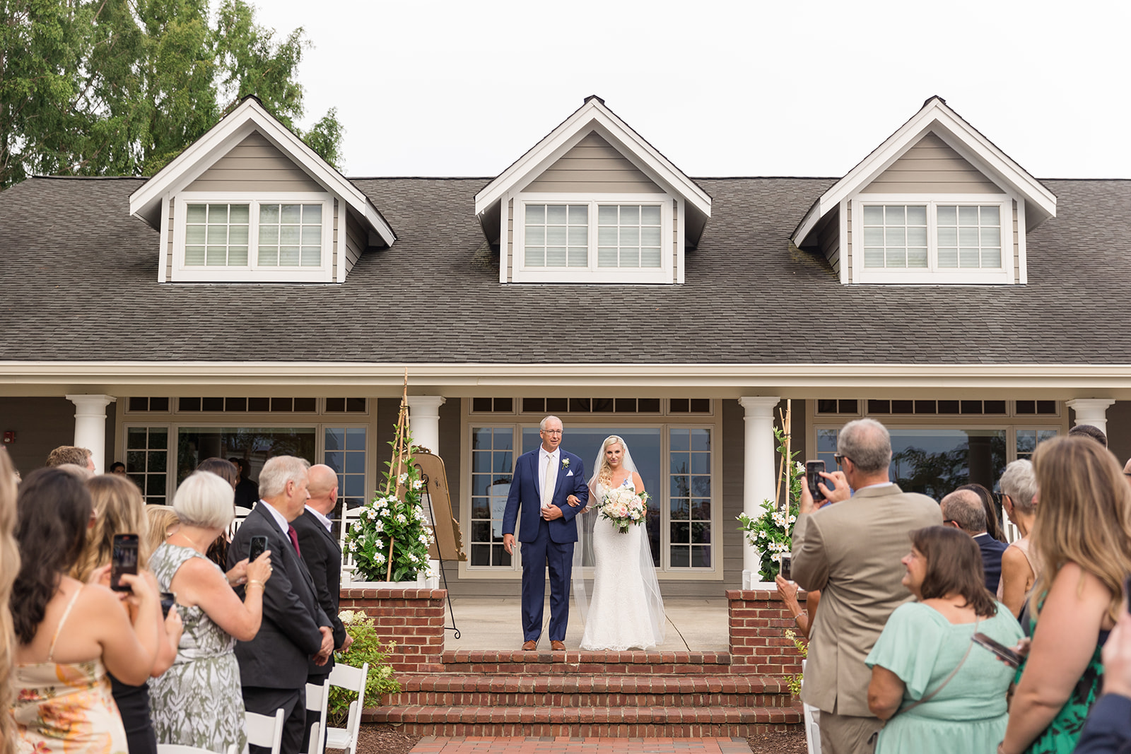 bride and dad approaching ceremony aisle