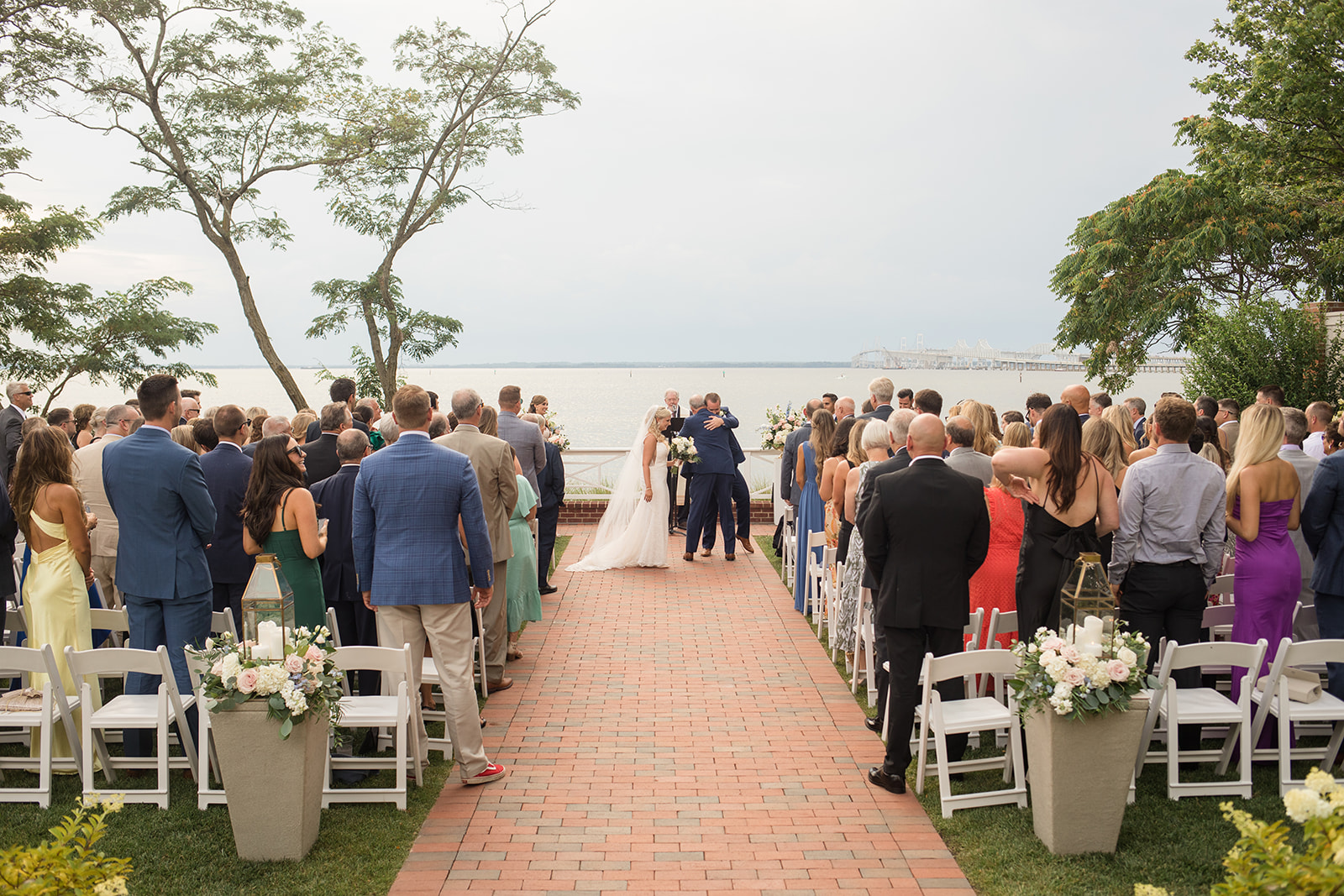 bride's parents give her away during ceremony