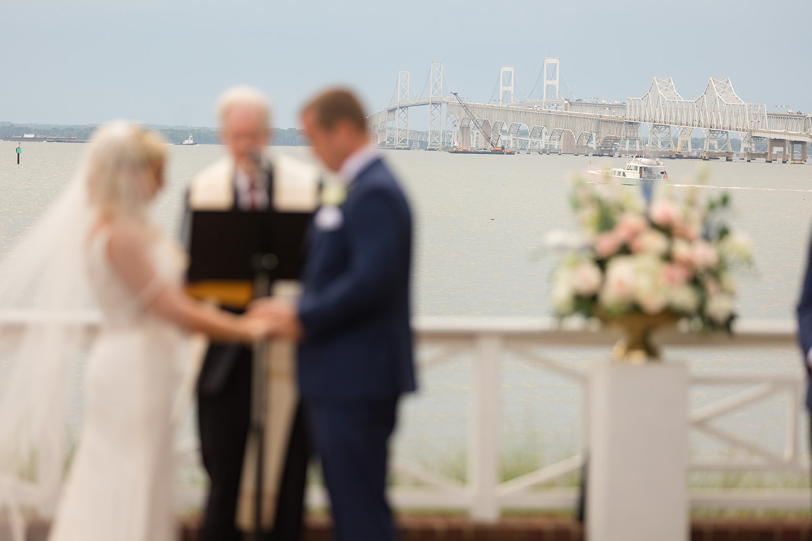 chesapeake bay bridge behind couple getting married