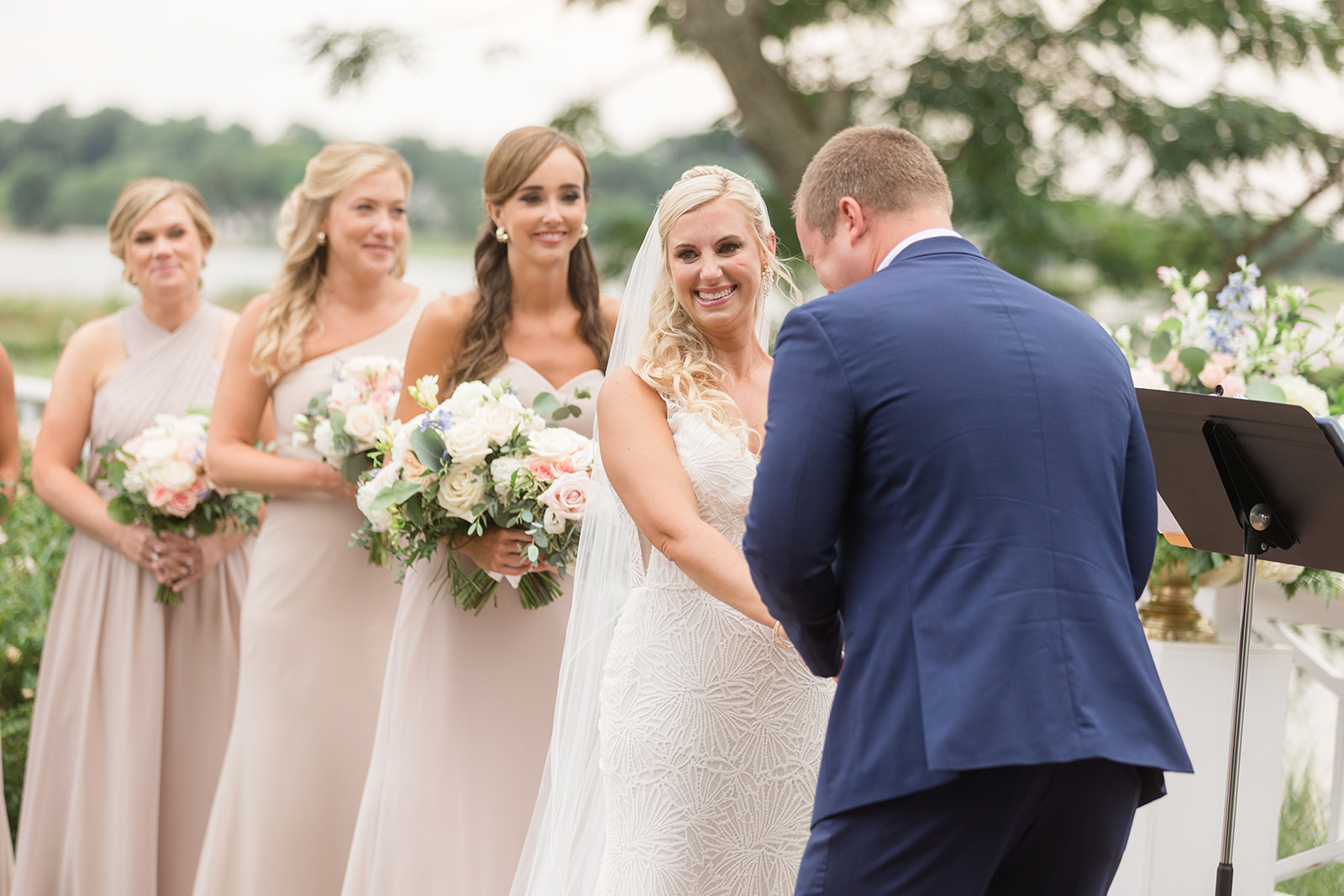 groom laughs during wedding ceremony