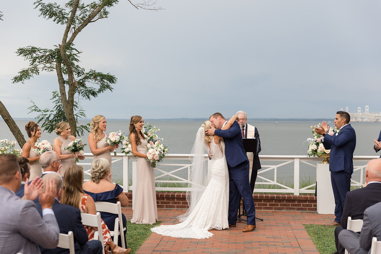 bride and groom first kiss during ceremony