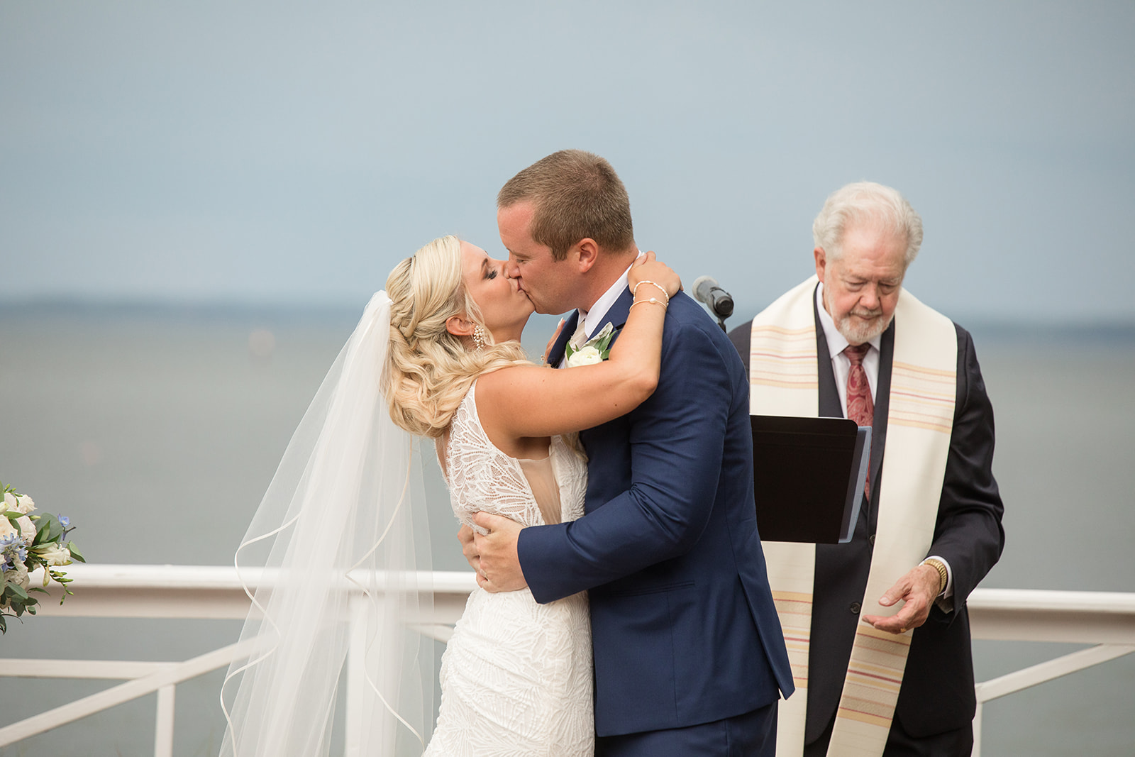 bride and groom first kiss during ceremony