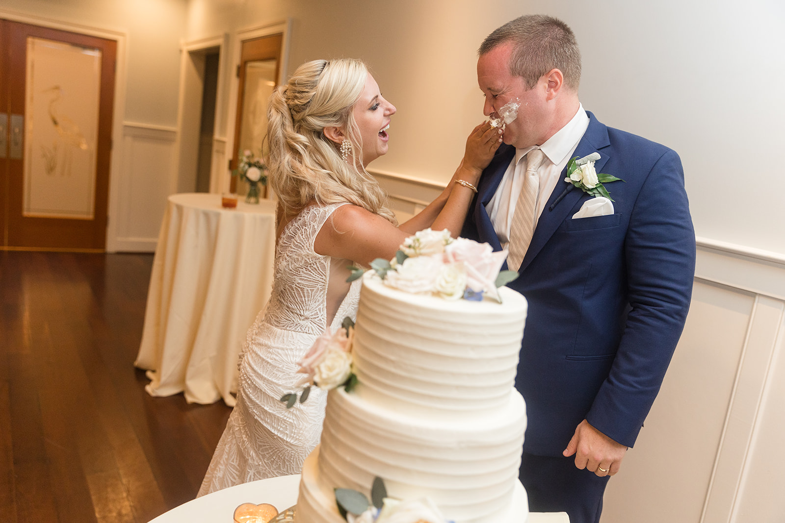 bride and groom cake cutting smash into face icing