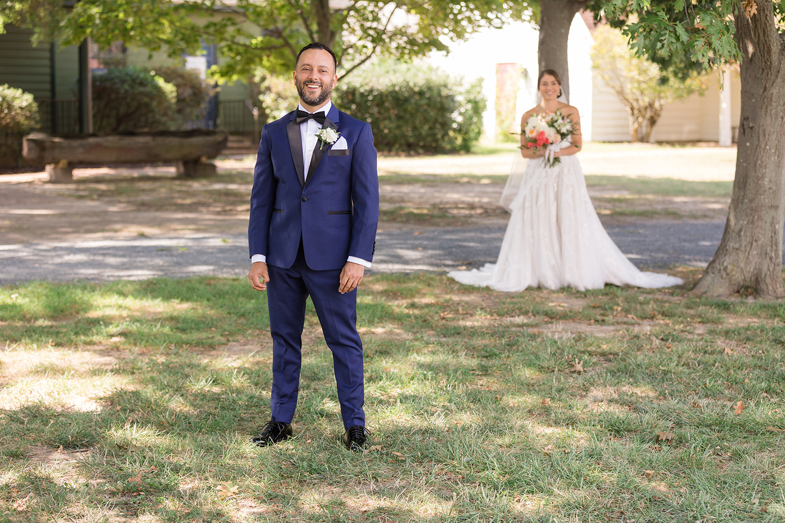 bride behind groom for first look