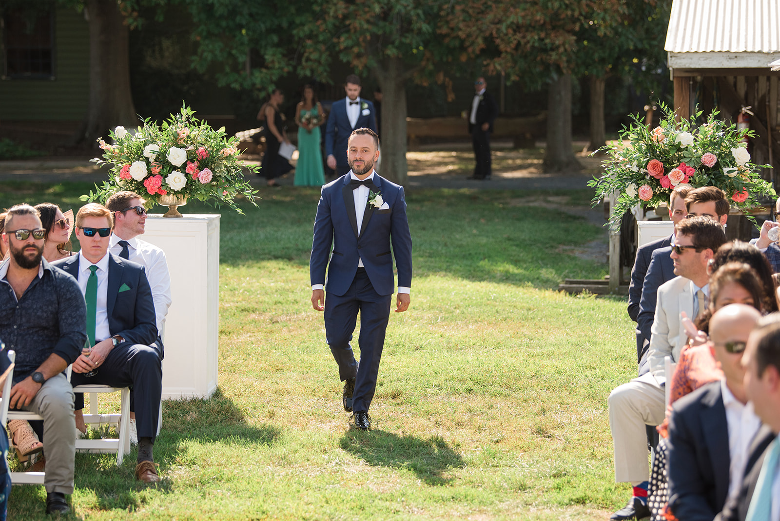 groom coming down the aisle at wedding