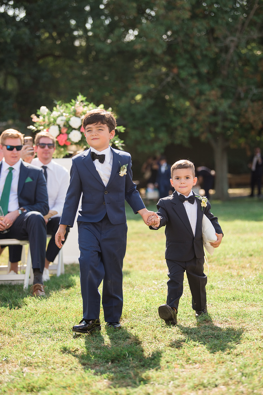 ring bearers coming down wedding aisle