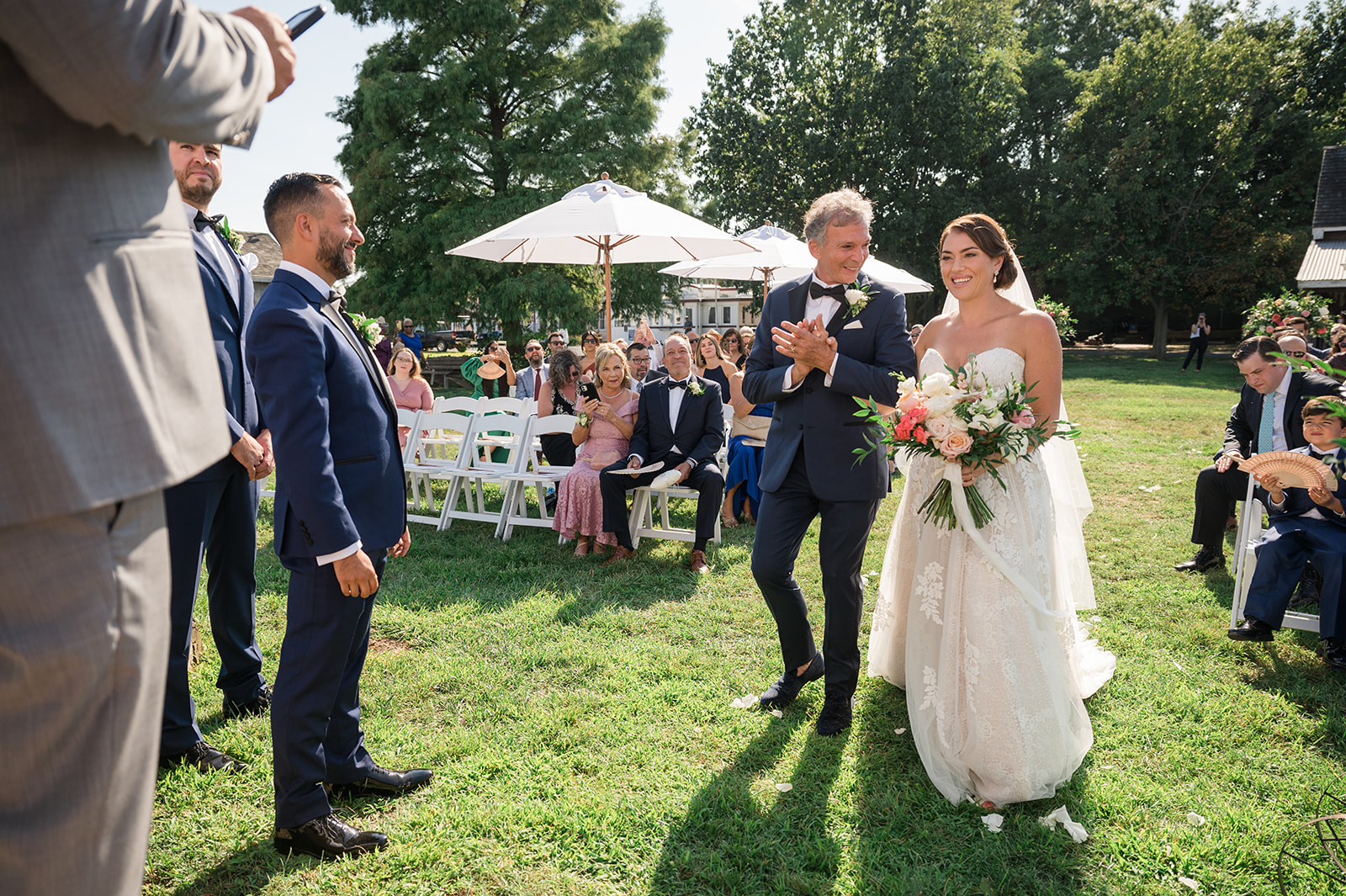 bride walking down the aisle with dad