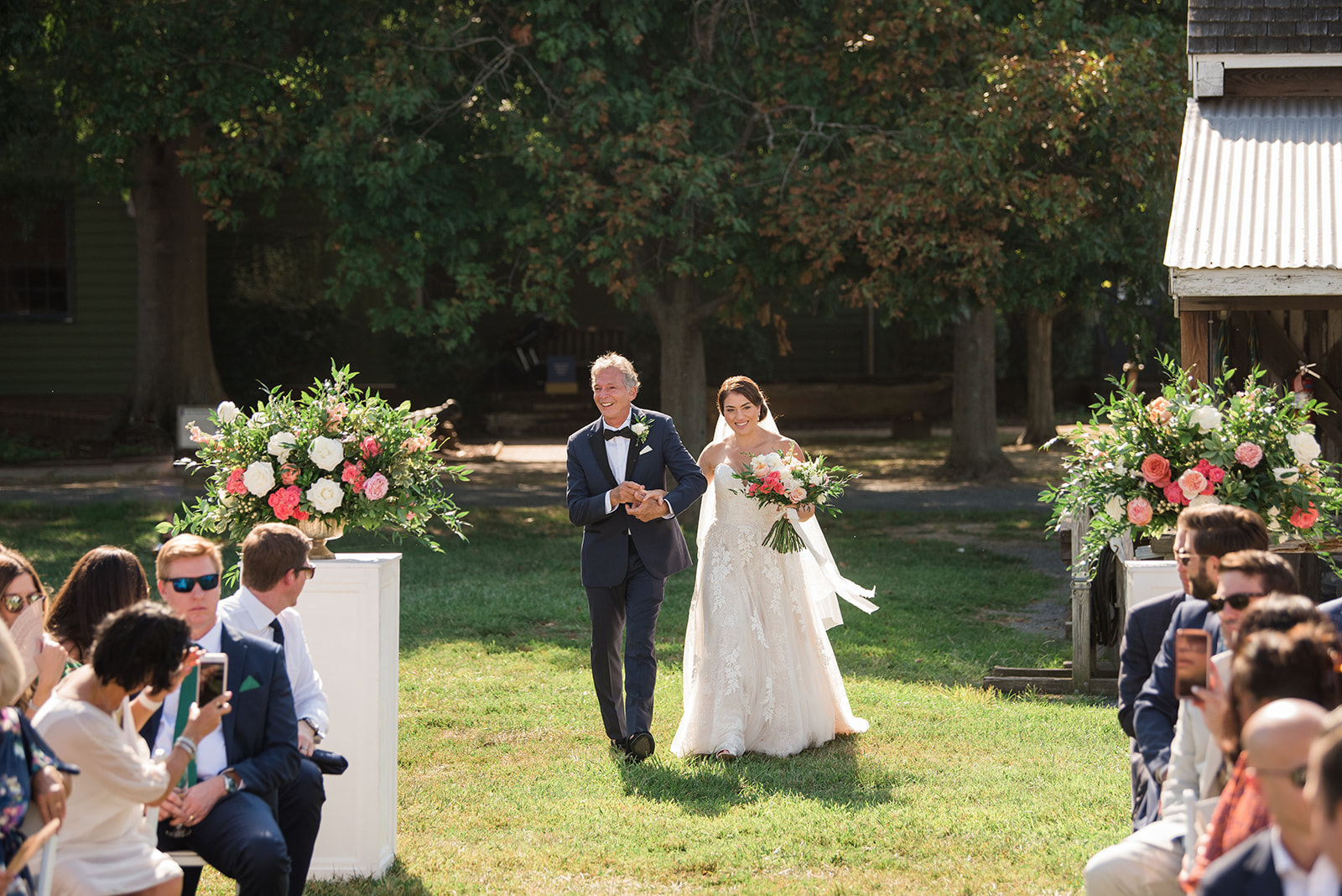 bride walking down the aisle with dad