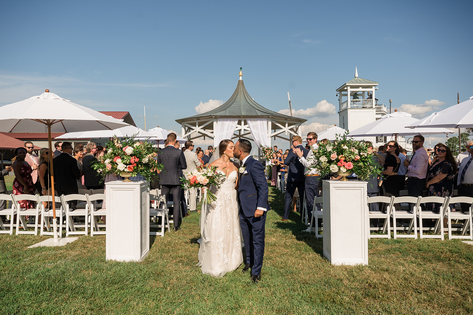 bride and groom kiss during ceremony