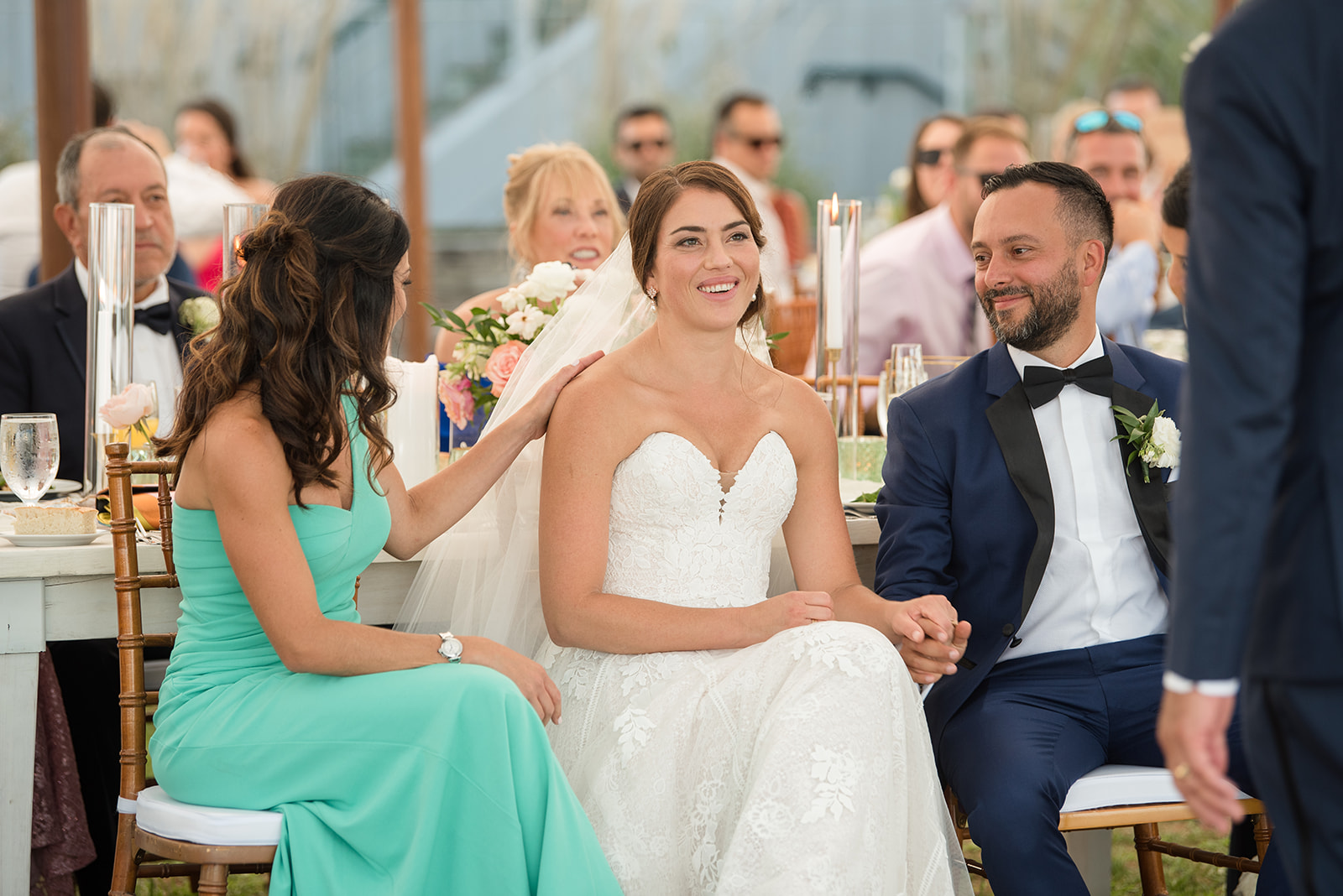 bride and groom listening to speeches