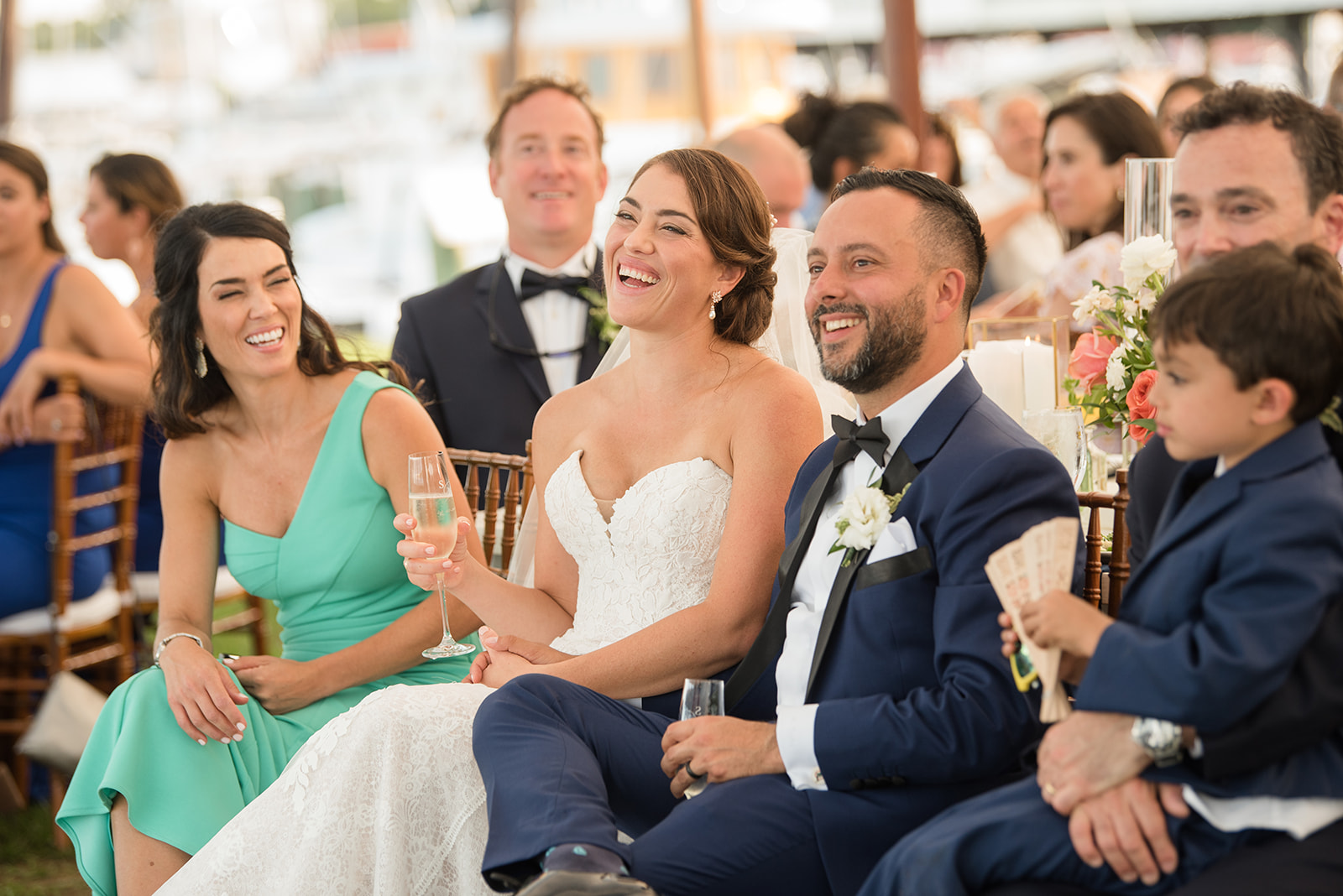 bride and groom listening to speeches