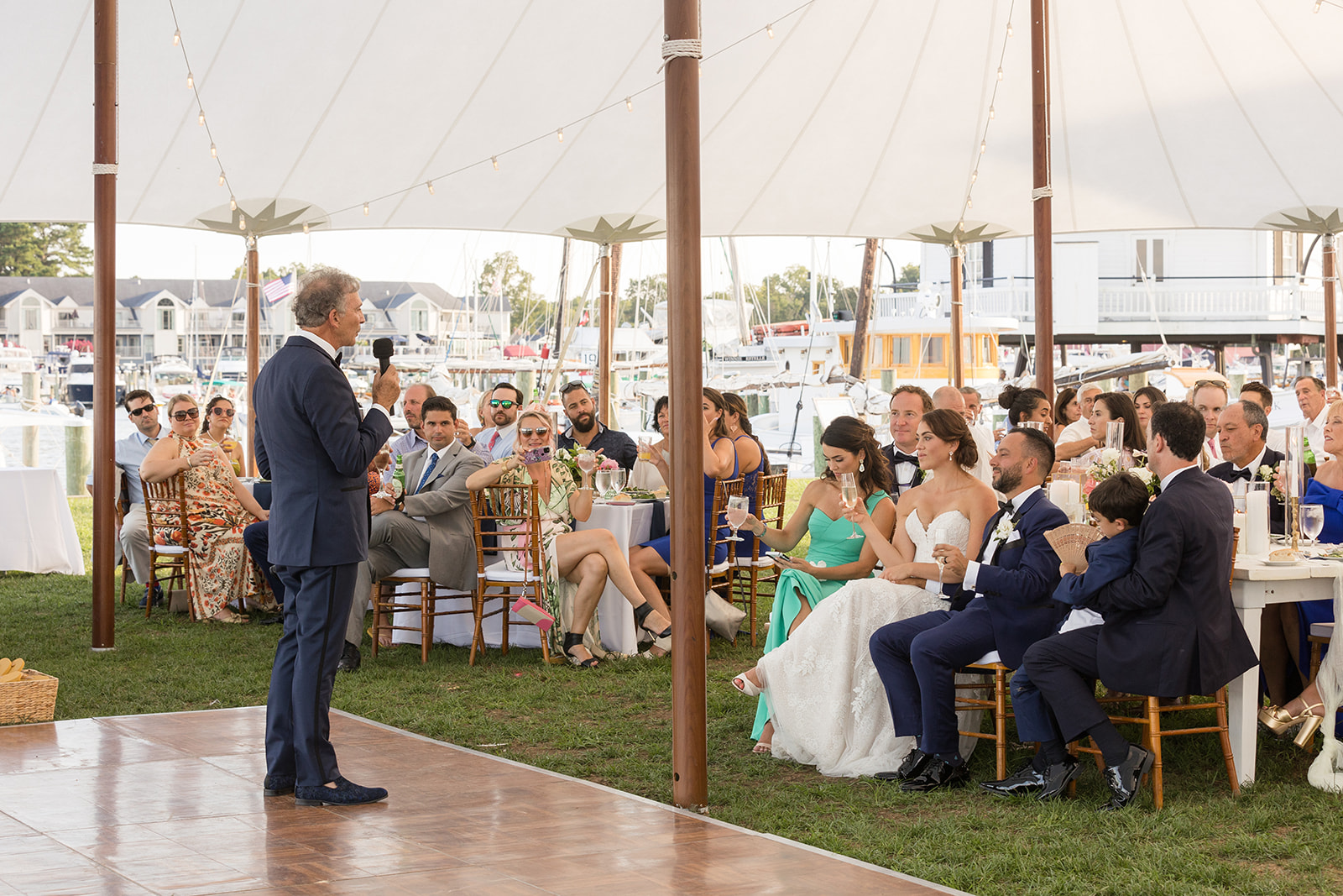 bride and groom listening to speeches