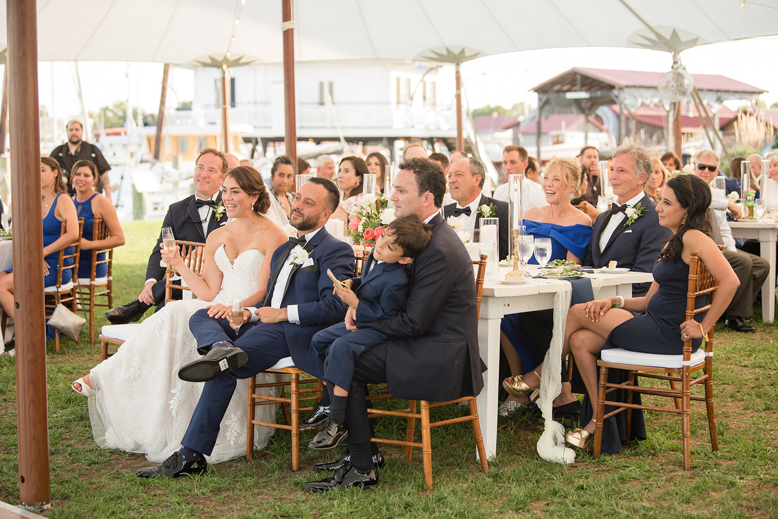 bride and groom listening to speeches