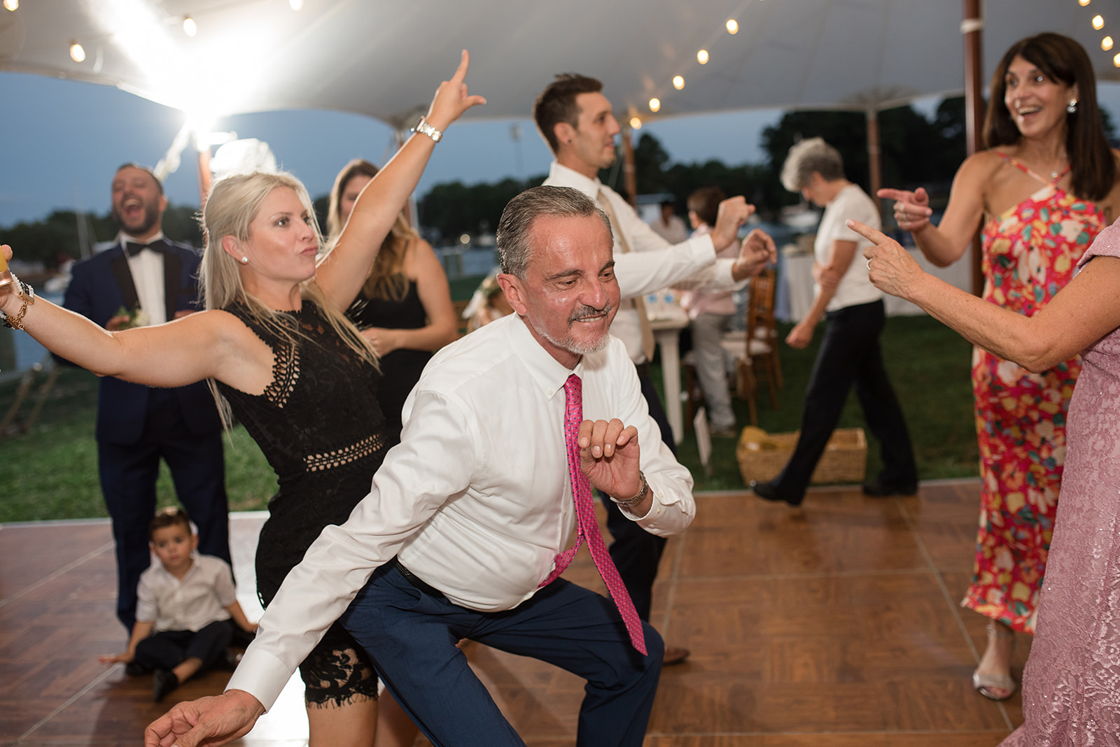 wedding dancing guests candid