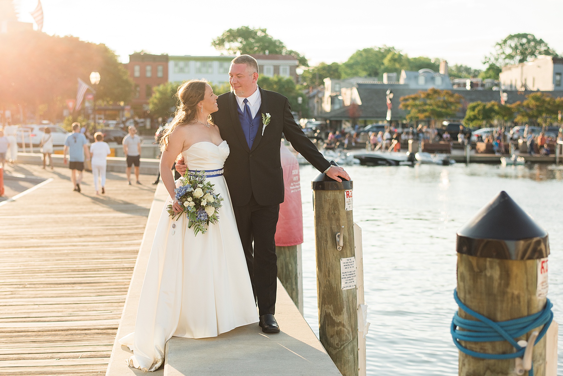 bride and groom on annapolis dock