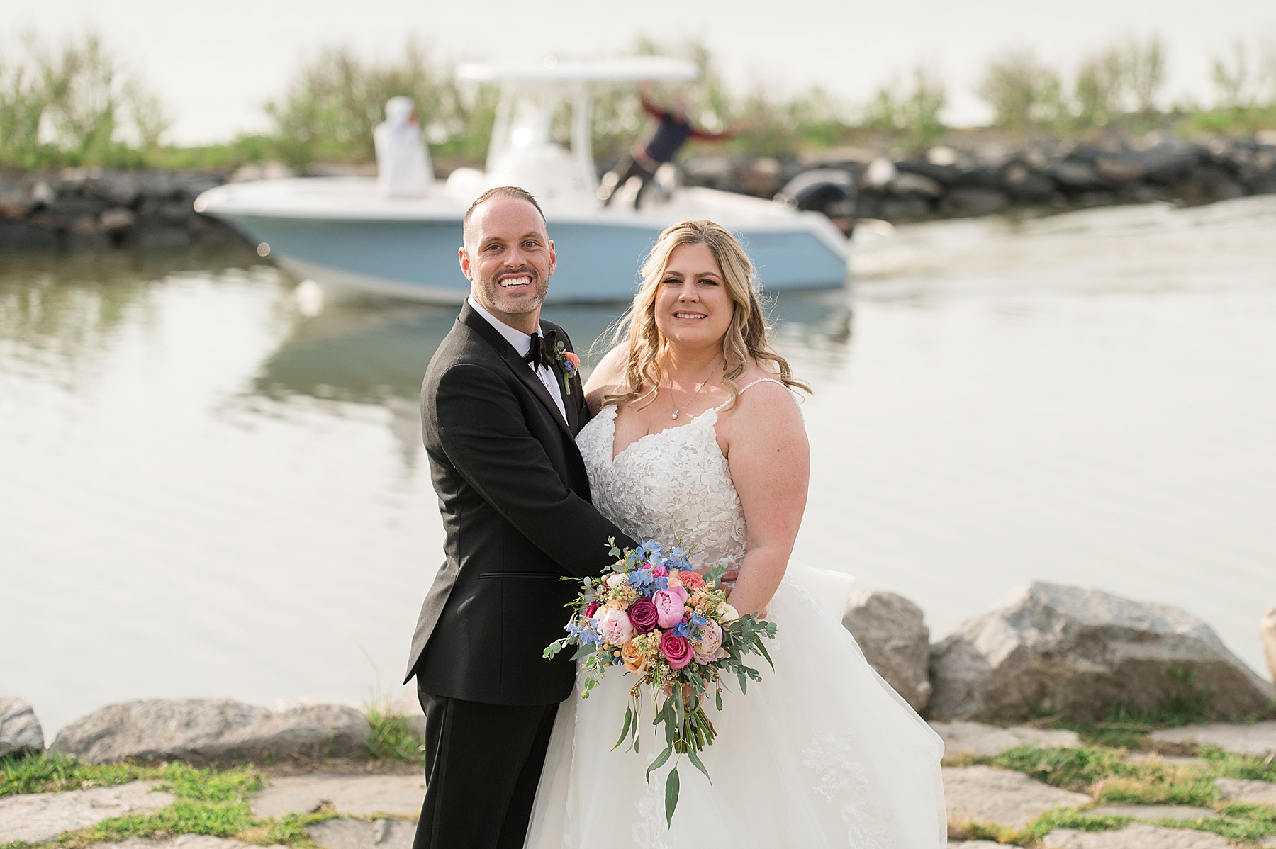 bride and groom smiling at camera